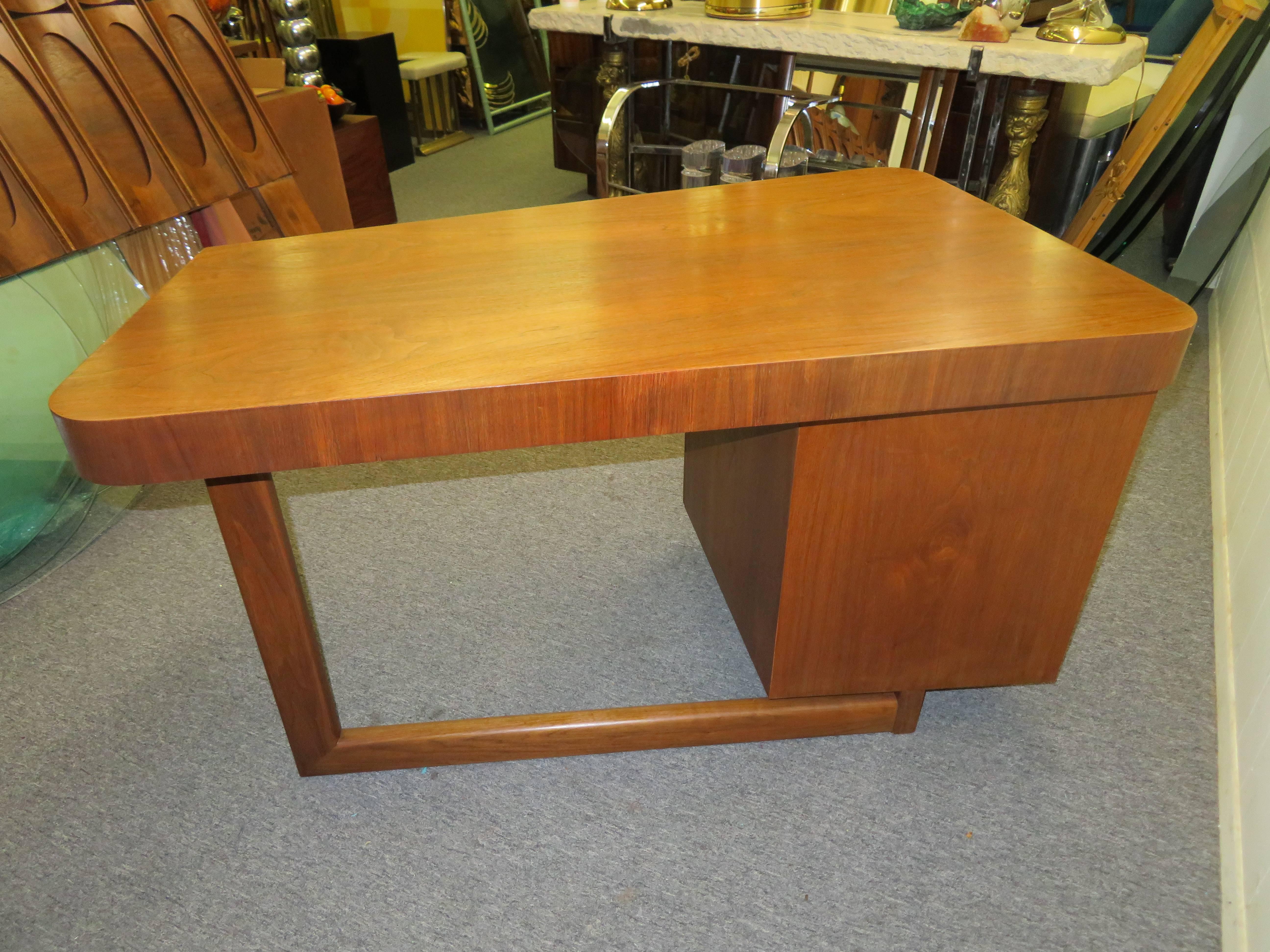 American Mid-Century Modern Asymmetrical Walnut Desk Attributed to Gilbert Rohde