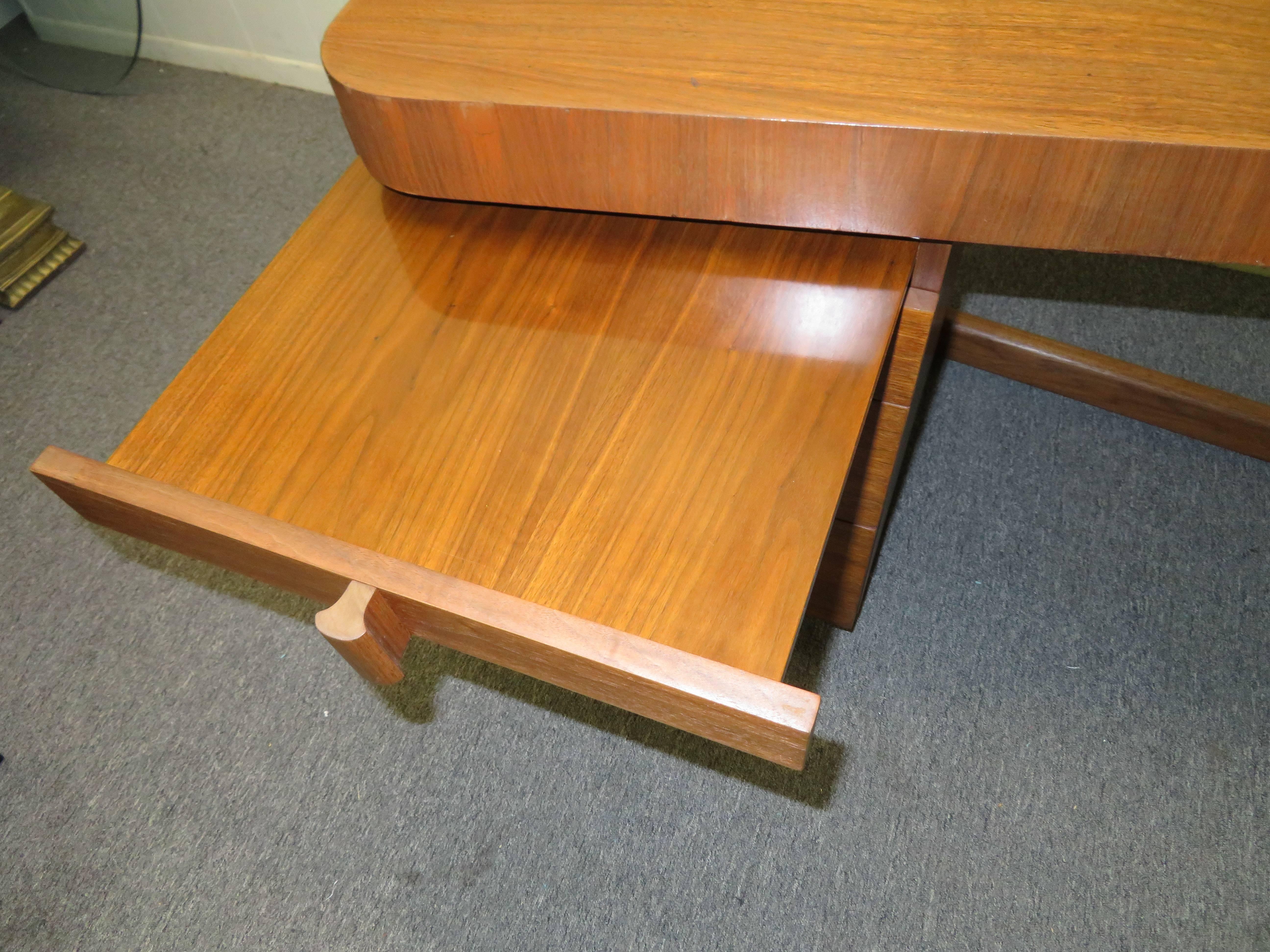 Mid-Century Modern Asymmetrical Walnut Desk Attributed to Gilbert Rohde 1