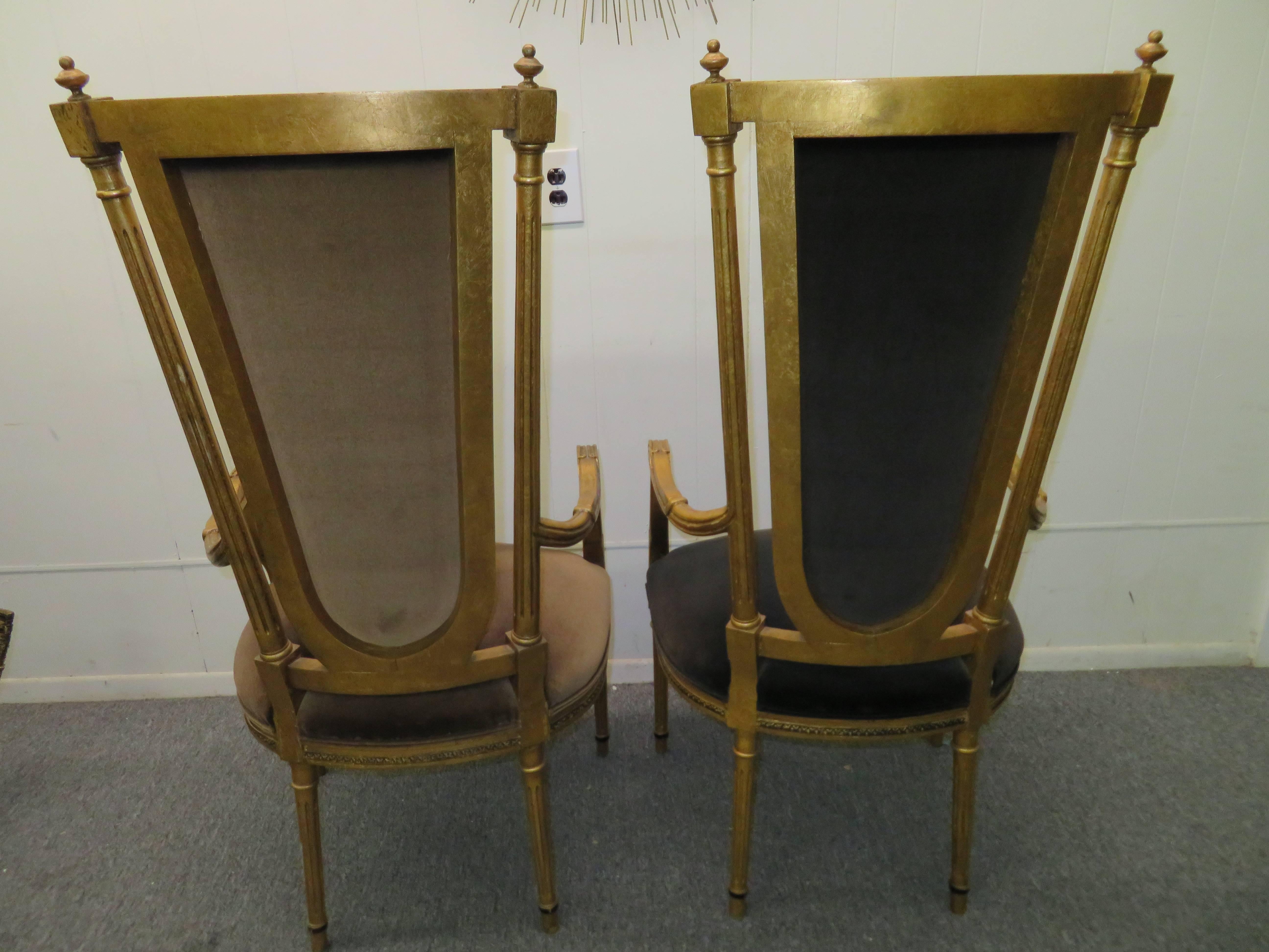Stunning pair of Maison Jansen style Hollywood Regency neoclassical gilded gold arm chairs. When we purchased these from their original owner they were used as dining chairs at the head of the table-just gorgeous! Use them anyway you please-they