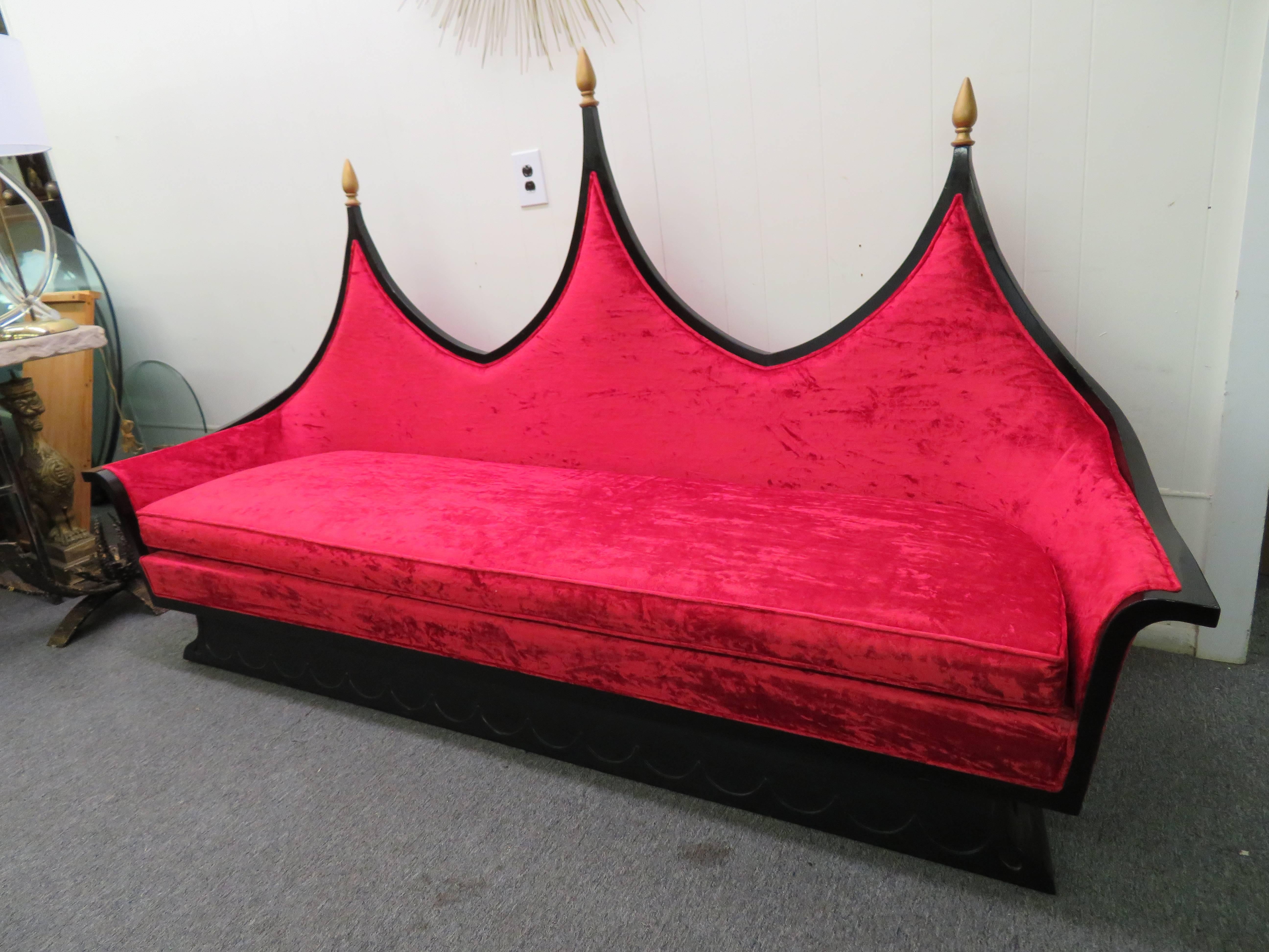 Magnificent and rare Hollywood Regency James Mont style black lacquered sofa in amazing vintage condition. Believe it or not this piece has survived so well because it has been covered in plastic for the last 60 years so the fabric and foam are in