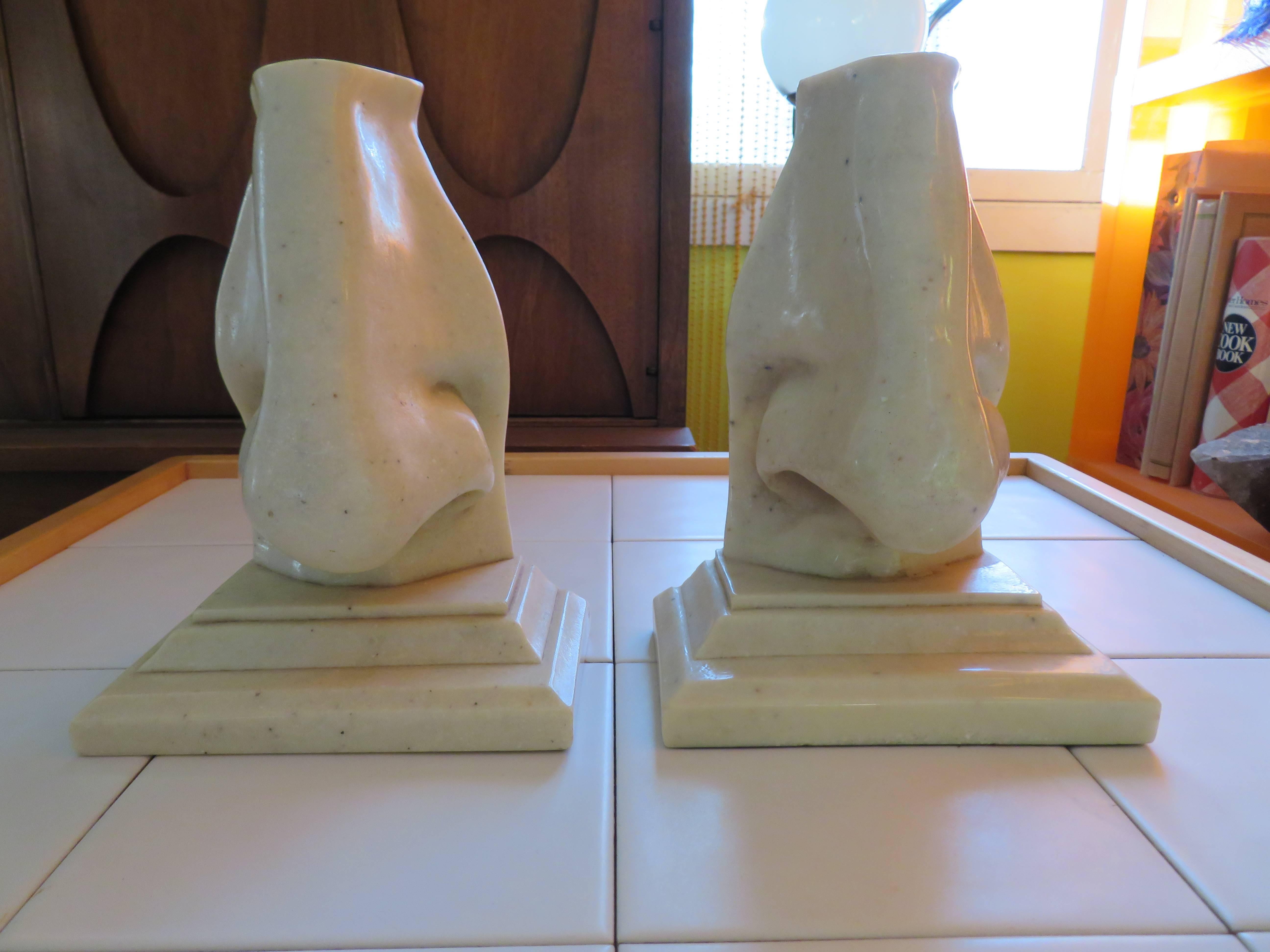 Unusual pair of oversized Italian marble composition bookends. Outrageous and fun, a must have for the person who already has everything. I am sure they don't have a pair of these!