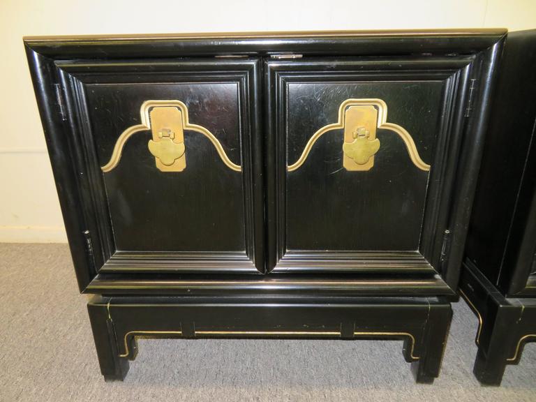 Gorgeous pair of Asian Modern chinoiserie style nightstands. These Mid-Century stands are in remarkable vintage condition with only light signs of age. The glossy black lacquer has acquired a wonderful aged patina and still looks great-only minor