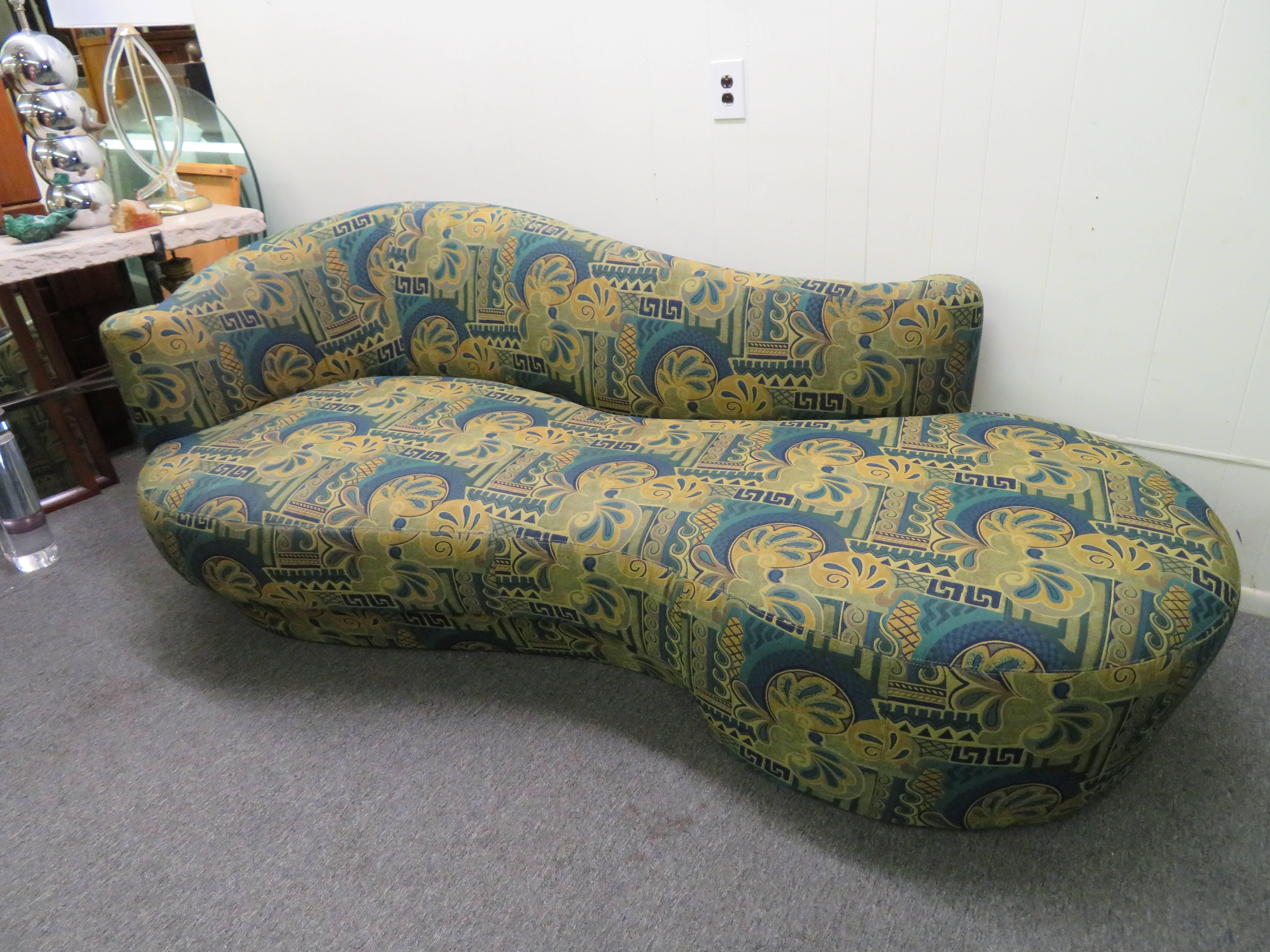 Fabulous Vladimir Kagan designed kidney shaped sofa with gorgeous scrolled back. Original fabric is in great vintage condition and looks fabulous. Weiman label is on the underside.