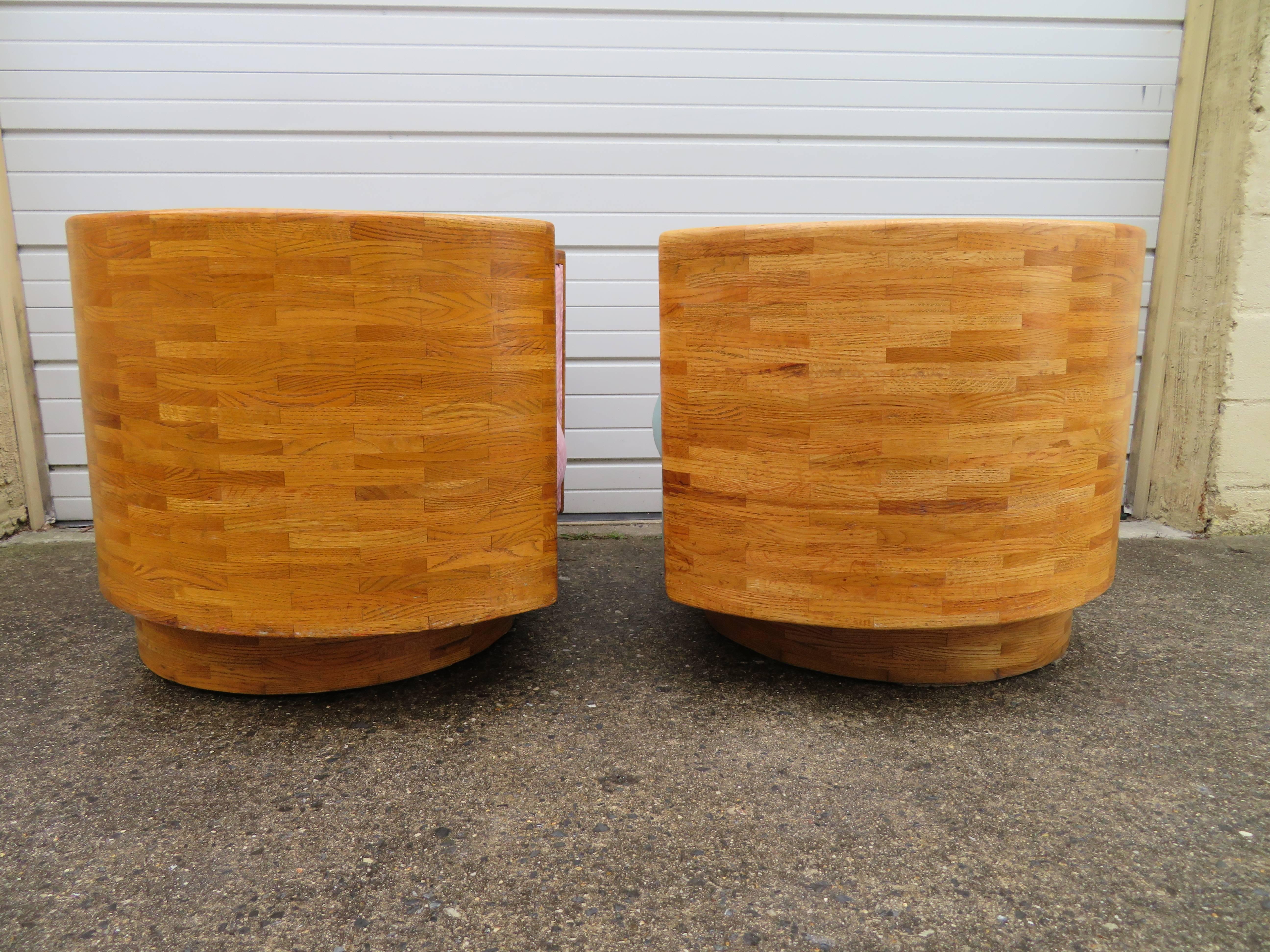Unusual and rare pair of Milo Baughman style butcher block barrel back swivel chairs. This is the first pair of these solid wood chairs we have ever seen. Made like a butcher block table with solid maple-these chairs are super wide and heavy. The