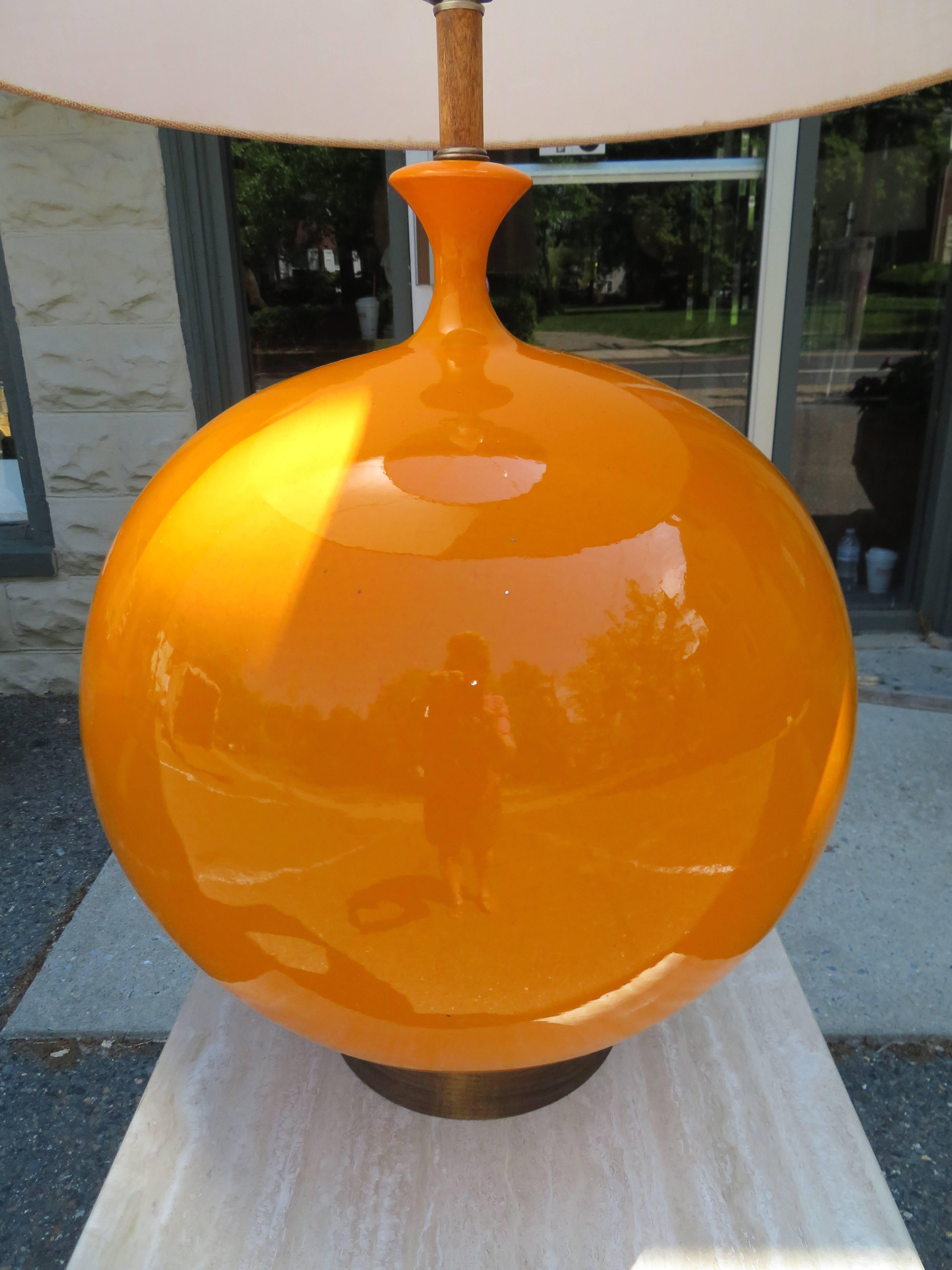 Absolutely massive orange glazed ceramic orb lamp. This spectacular lamp stands over 50