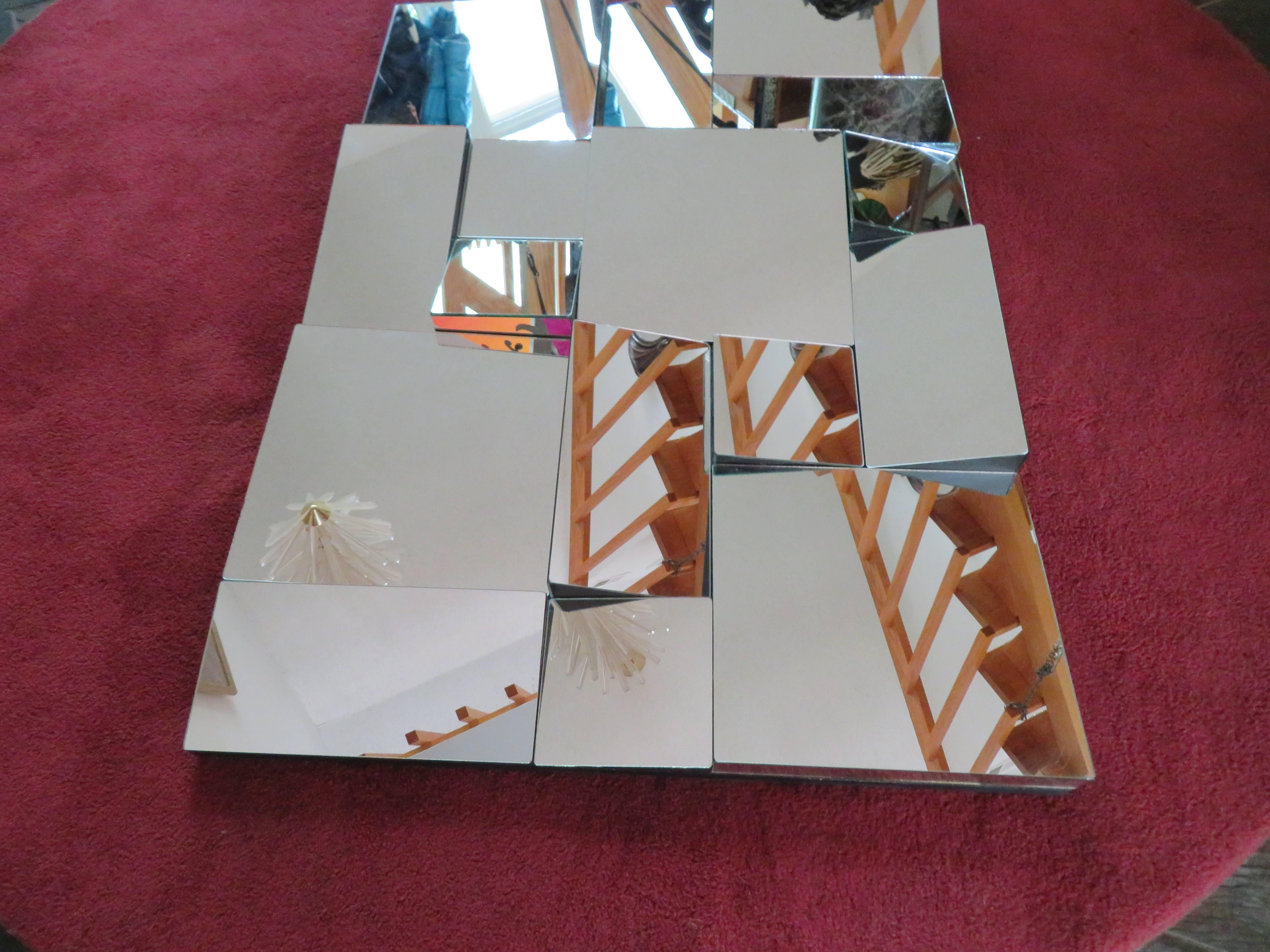 A vintage 1970s Neal small mirror.
Cubist style mirror in a black wood frame.
Can be hung vertically or horizontally. This piece measures 30