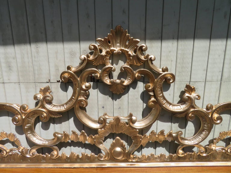 Fabulous Regency modern ornate cast metal gilded gold king-size headboard. This piece is in fantastic original condition and is ready to slip right in to your glamorous boudoir.