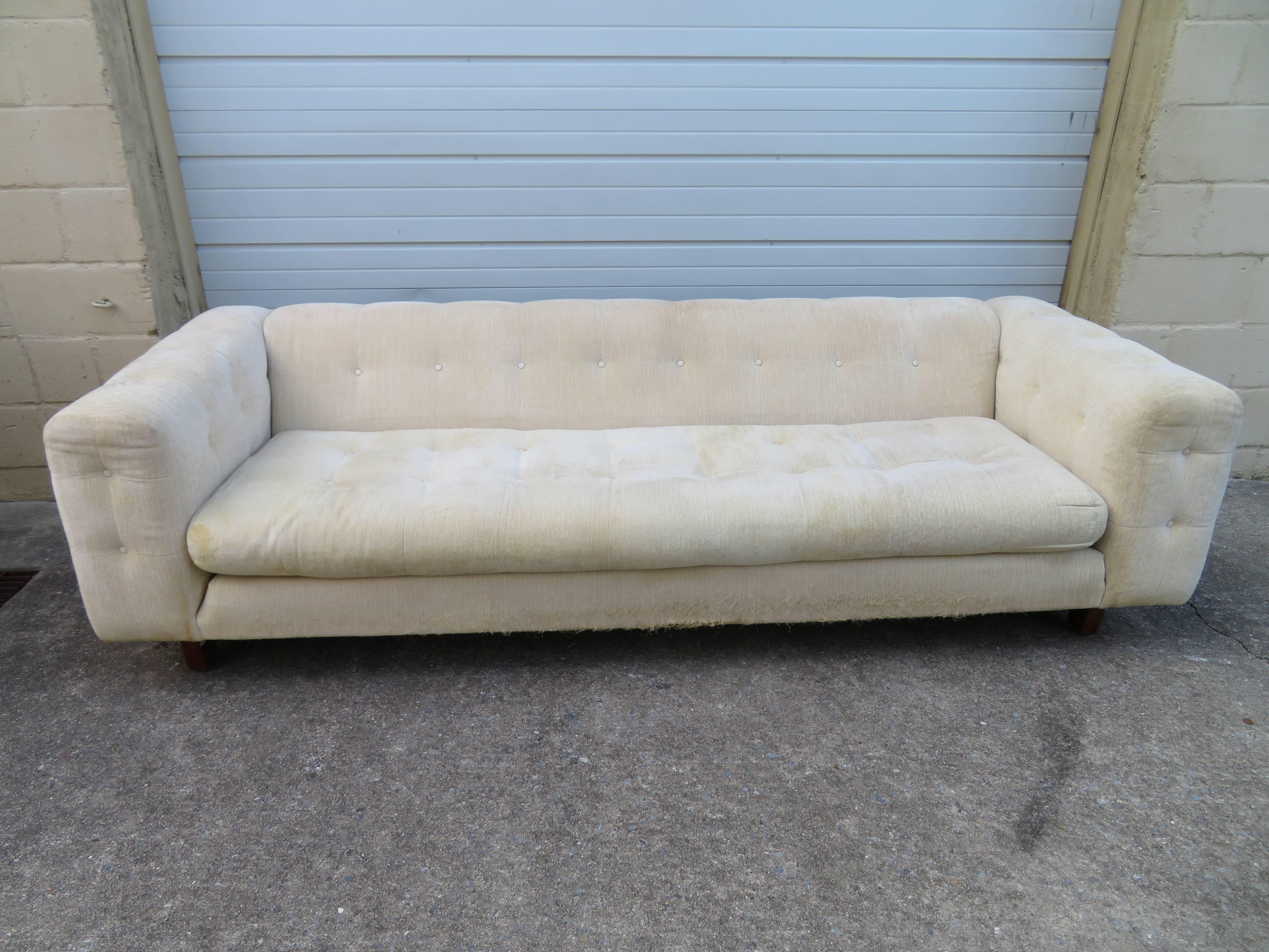 Unusual Milo Baughman style W & J Sloane tufted even arm tuxedo sofa. We love the thick chunky walnut legs-very interesting for sure! W. & J. Sloane furniture store in NYC set the national decorating taste of the United States, and over the years