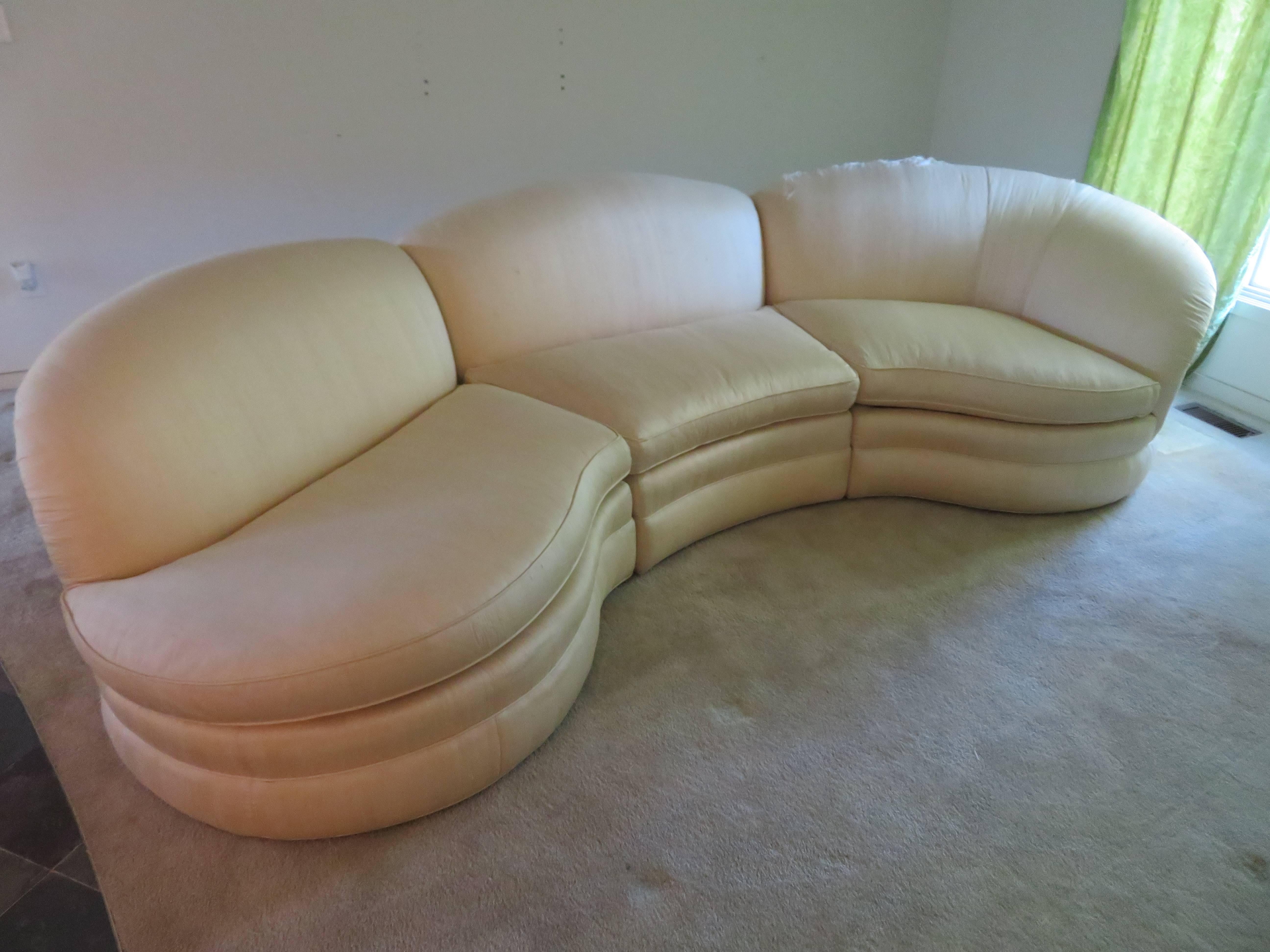 Stunning pair of three-piece curved sectional sofas. This pair will need to be reupholstered but cushions are still soft and super comfortable-seat cushions have combination foam and down. This sofas have Baker labels and are very high quality.