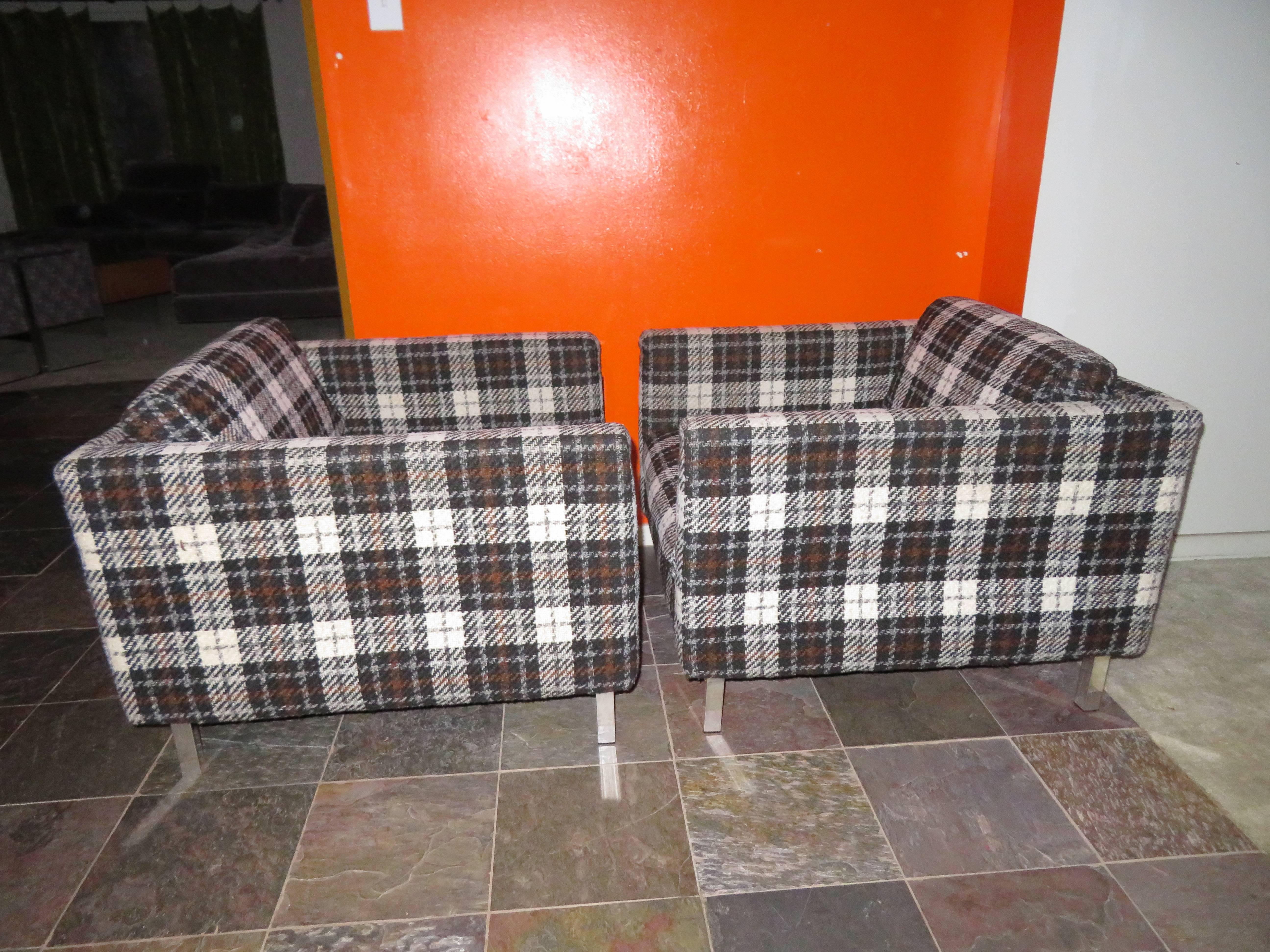 Handsome pair of black and white plaid Milo Baughman style even arm cube lounge chairs with chunky chromed legs. This pair retain their original plaid wool blend fabric still in good condition we love them as they are. We do have the original