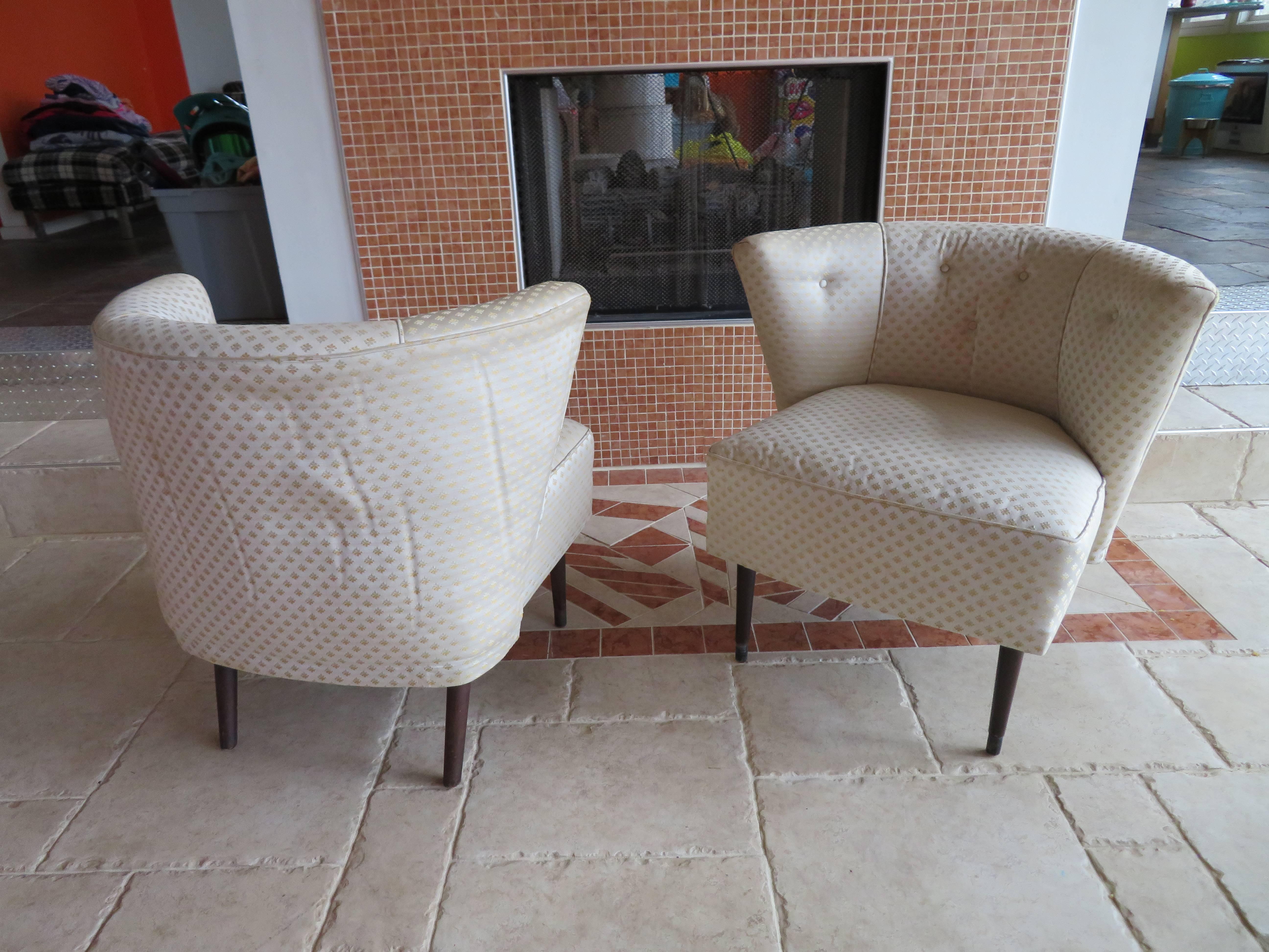 Lovely pair of sculptural Billy Haines style barrel back lounge chairs. Upholstery is clean but is dated-reupholstery is recommended.