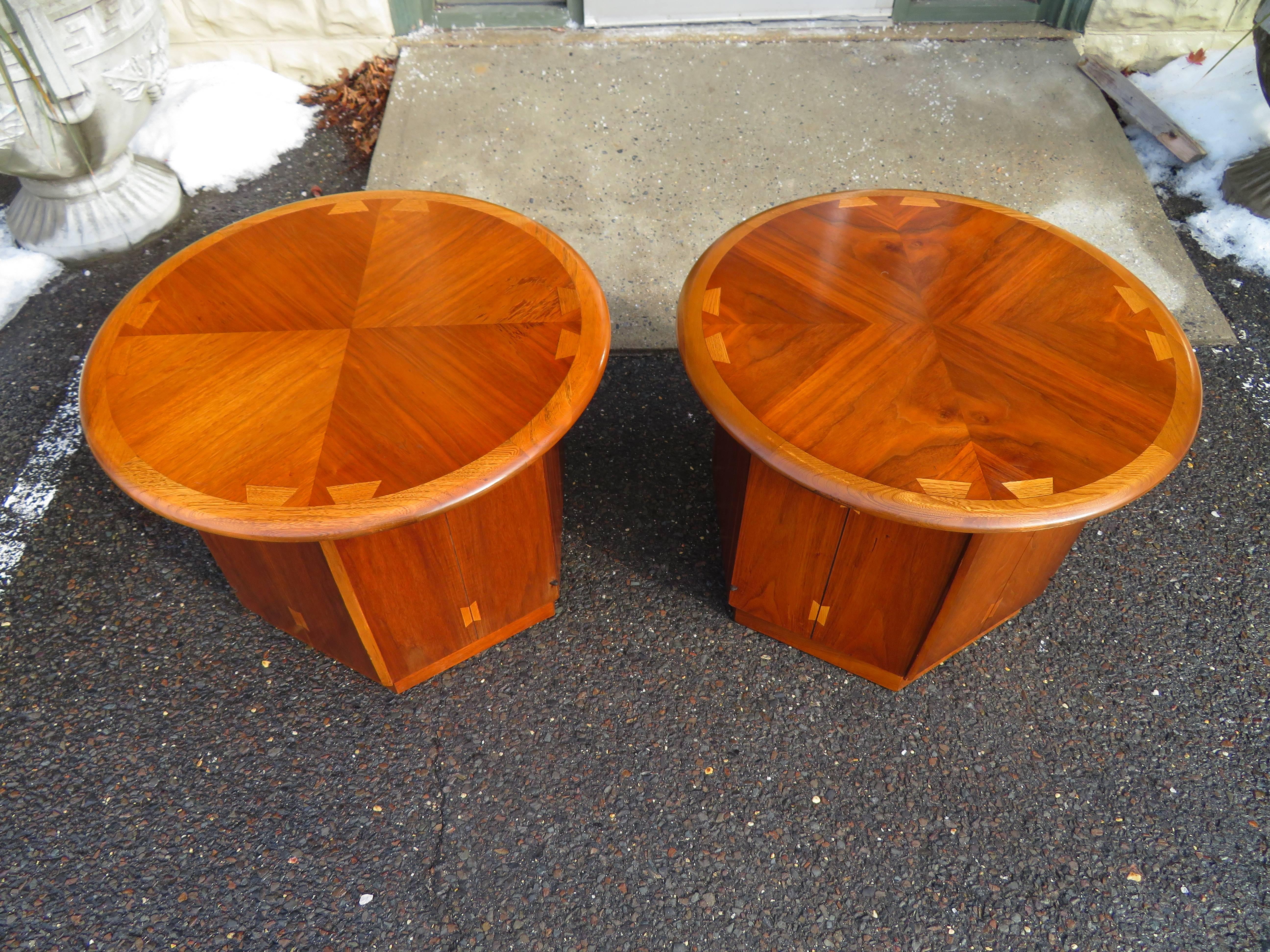 Lovely pair of Lane Acclaim walnut drum end tables. These table have two doors that open underneath and reveal a nice open space.