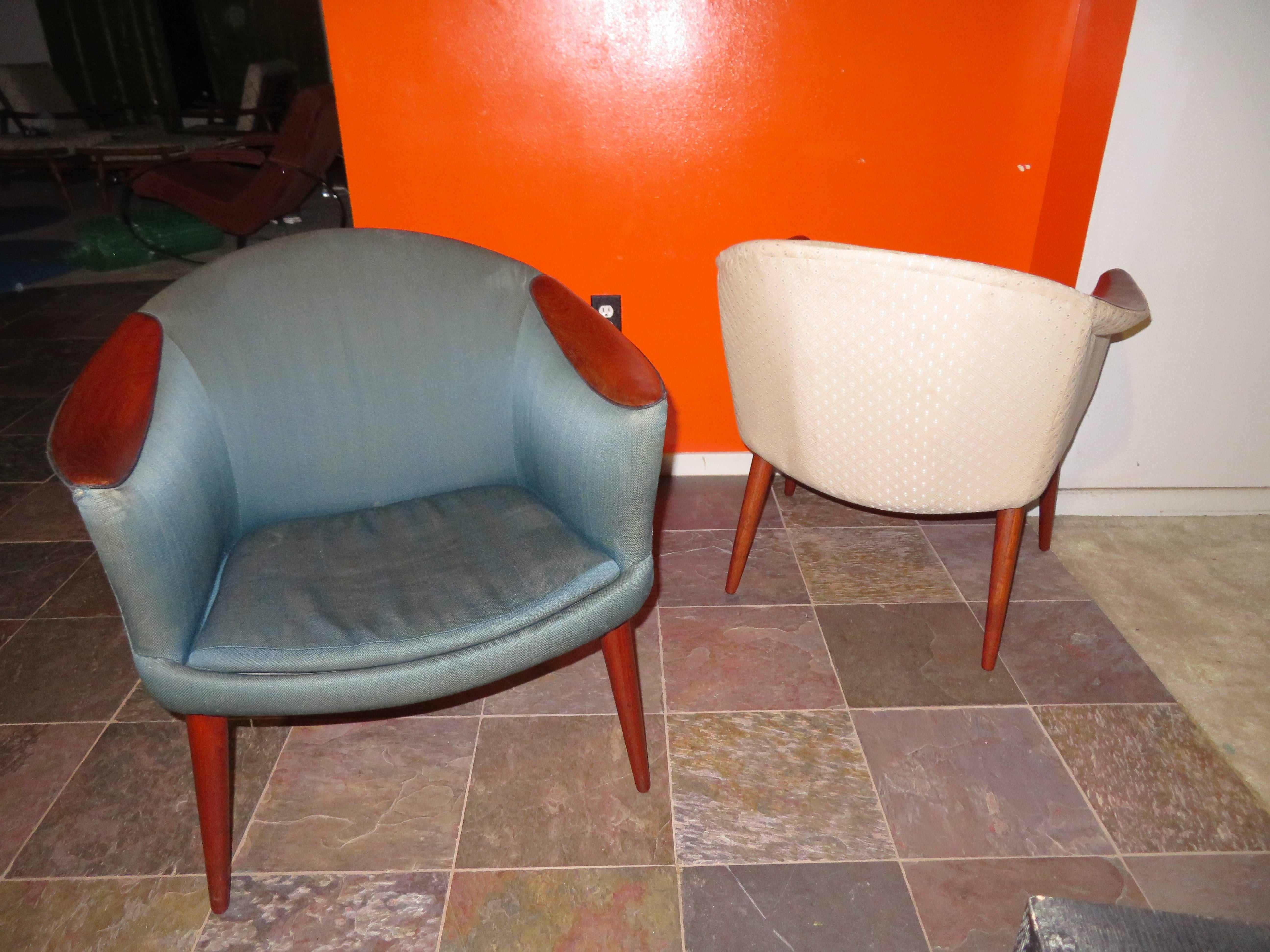 Wonderful pair of Nanna Ditzel style teak scoop lounge chairs. This pair will need new upholstery but that's what you designers are looking for anyway -right? Chairs have gorgeous sleek scooped teak arm pads with sexy long legs all having a warm
