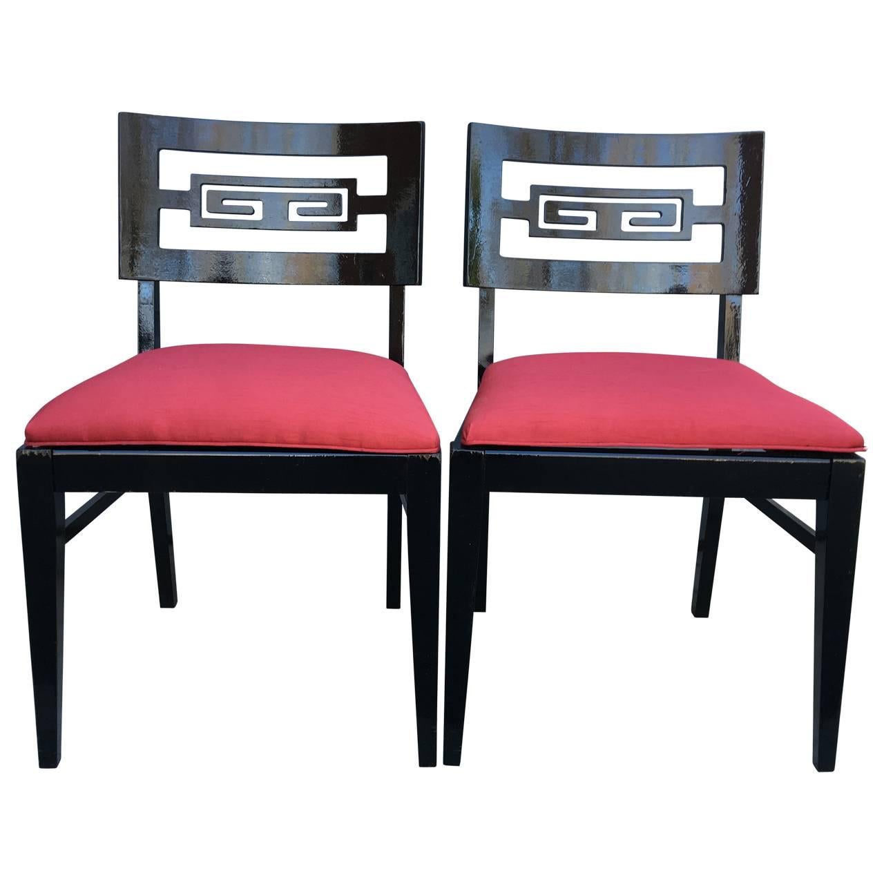 Two arm chairs and two dining chairs by James Mont style dining chairs. Black glossy paint.