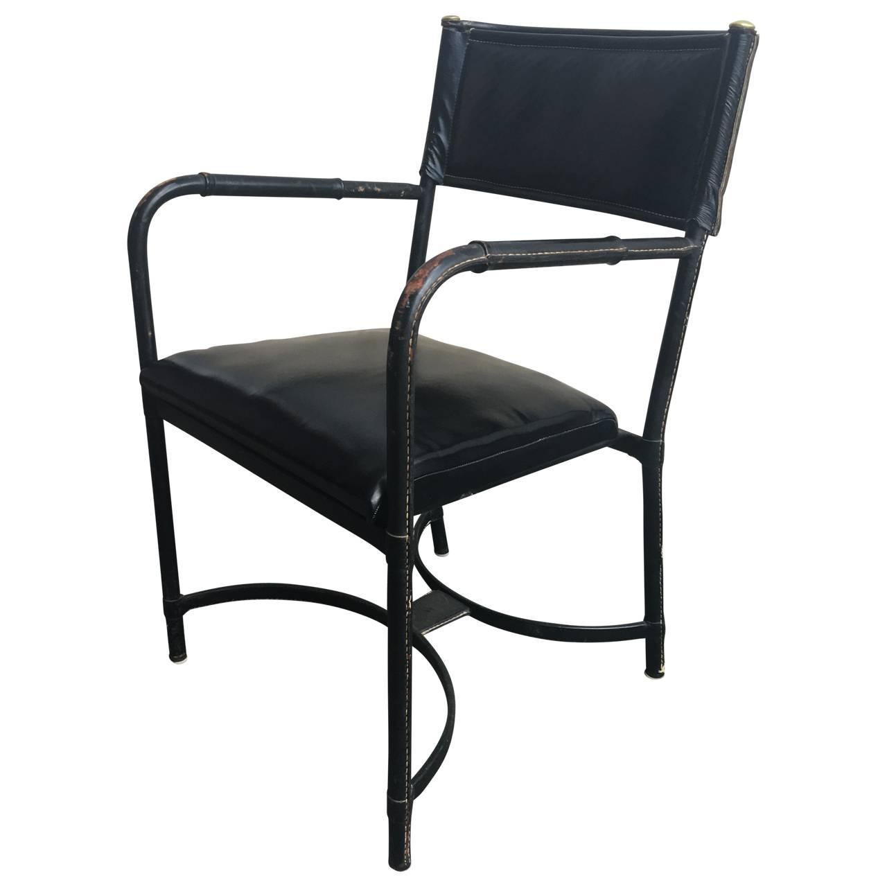 Two armchairs and four dining chair by Adnet in vintage hand-stitched black leather.
                         