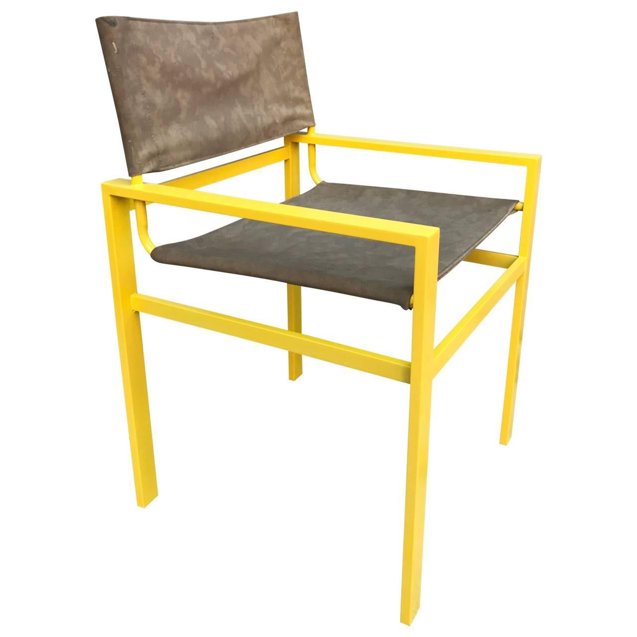 Mid-Century Modern Powder-coated bright yellow armchair with light brown faux suede upholstery.
This classic and sturdy armchair has been updated with bright yellow powder coated frame. The faux suede upholstery is new and very comfortable. In any