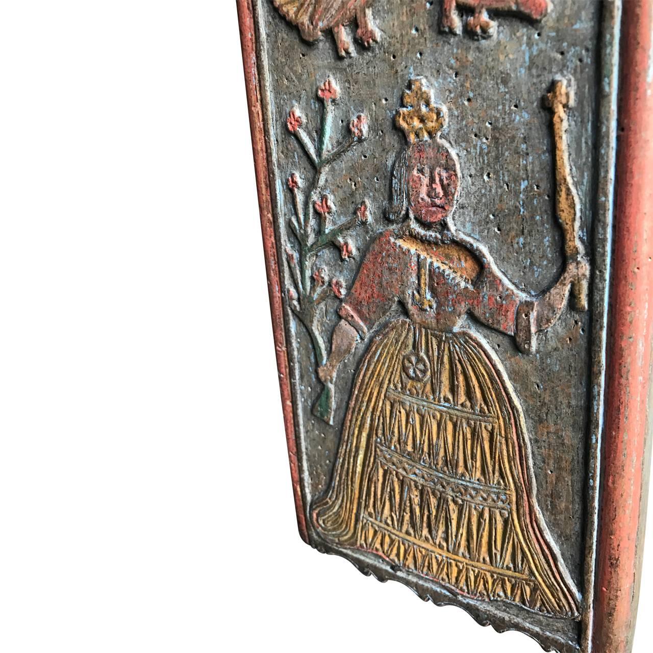 Charming piece of Scandinavian folk art as a love-token. The mangleboard is decorated in original colors and carvings, with "AMPD" initials and dated 1839. The "D" stands for "AMP"'s Daughter. Further carvings are queen