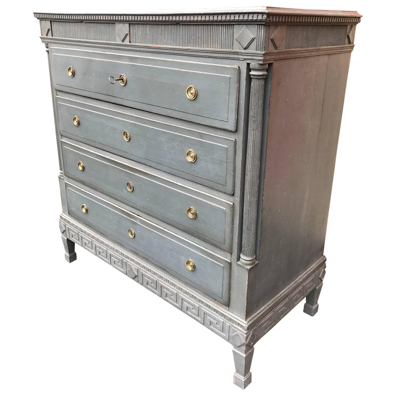 Great period six drawers case piece in dark Gustavian-grey. Two secrets drawers are hidden behind the fretwork and below dental moulding. See detailed image. This case piece has carved rosettes at the top, lovely carved columns and 'a la Grecque'