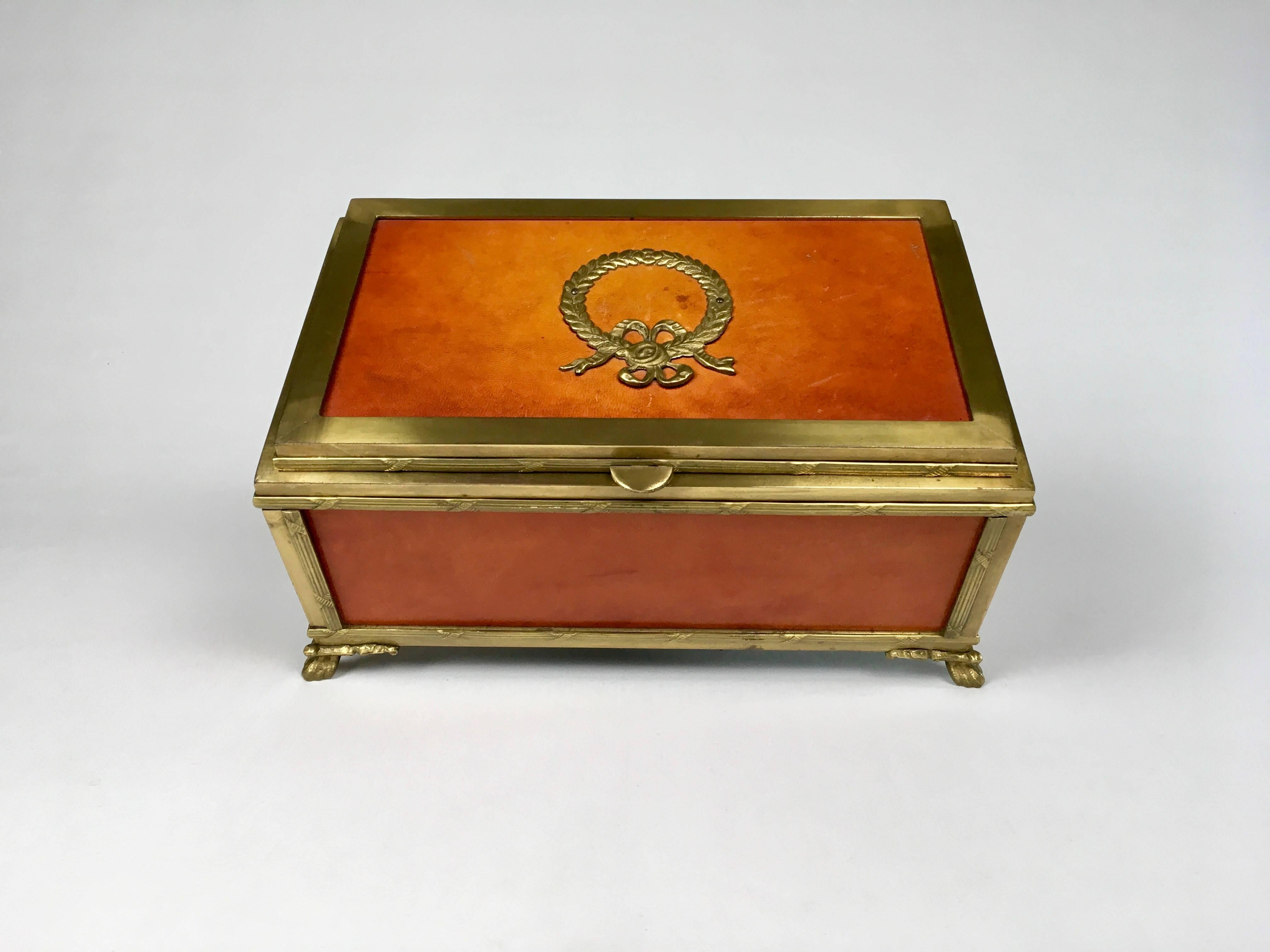 A French Napoleon brass and leather Box. French flair, made in Italy. Inside is lined in original dark brown felt. Heavy solid brass.