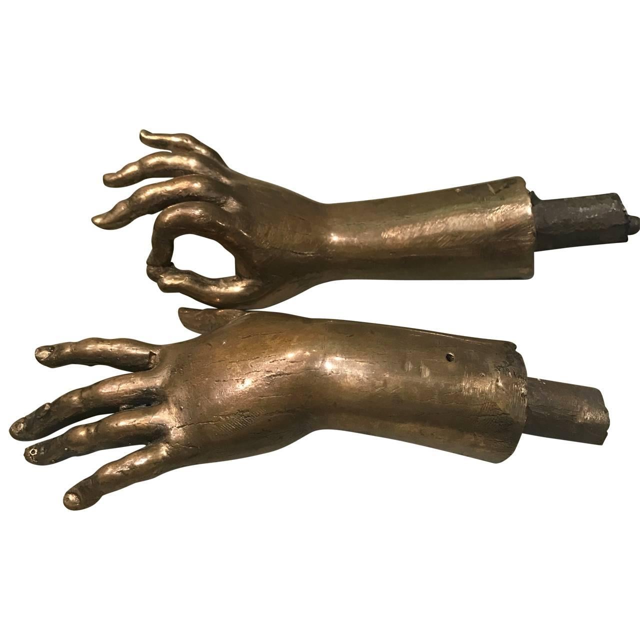 Pair of cast bronze hands.