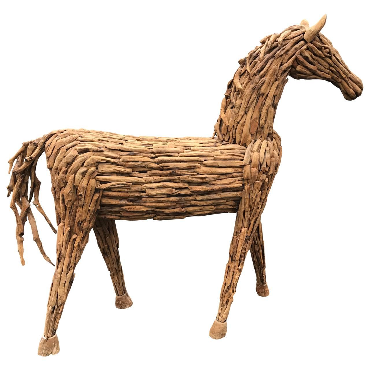 Three dimensional lifesize sculpture of horse in resting stance. Each layer nailed by hand, showing mastery of technique. A unique one of a kind art medium.