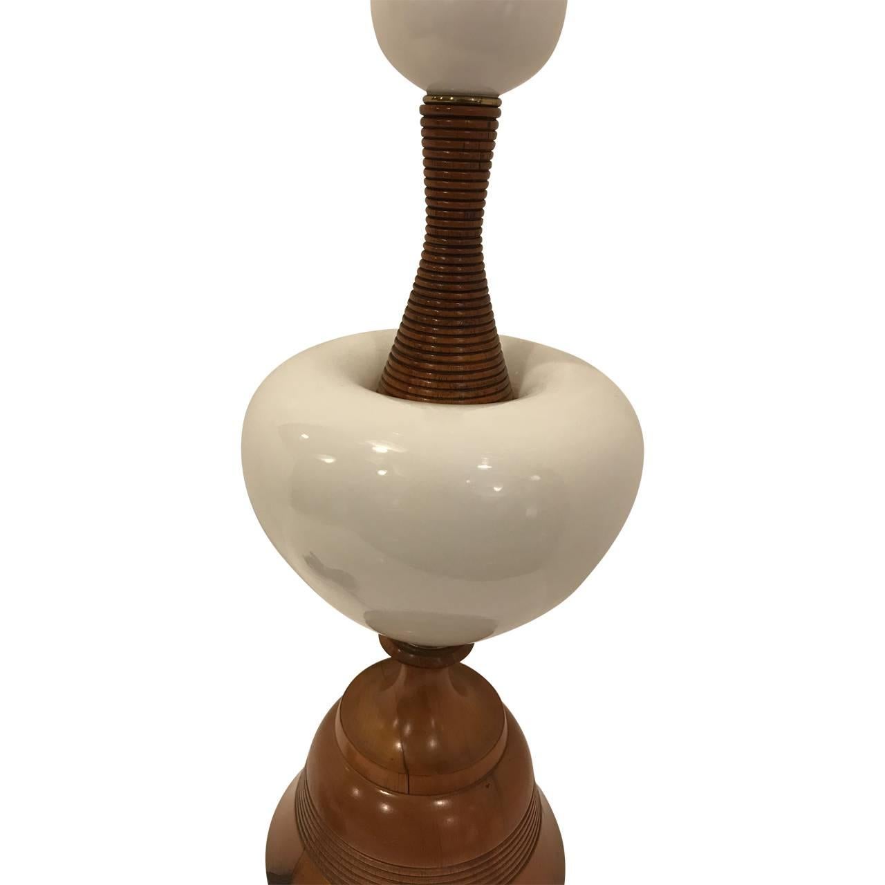 Vintage Opaline white glass and walnut tall table lamp. This striking desk or table lamp has beautifully rounded opaline Charming desk lamp with two white opaline glass centerpieces.