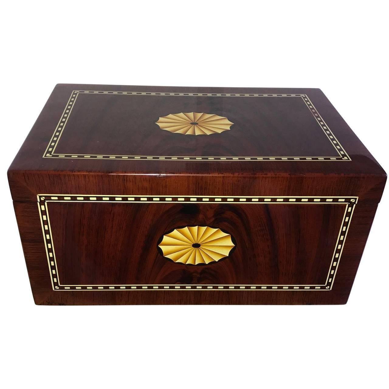 Nice large vintage humidor with Classic lemon-wood veneer decoration on the top and front. Note the hygrometer is missing, but can be easily replaced.

Maker is likely to be El Rey Del Mundo of Cuba, but I have not been able to verify this with