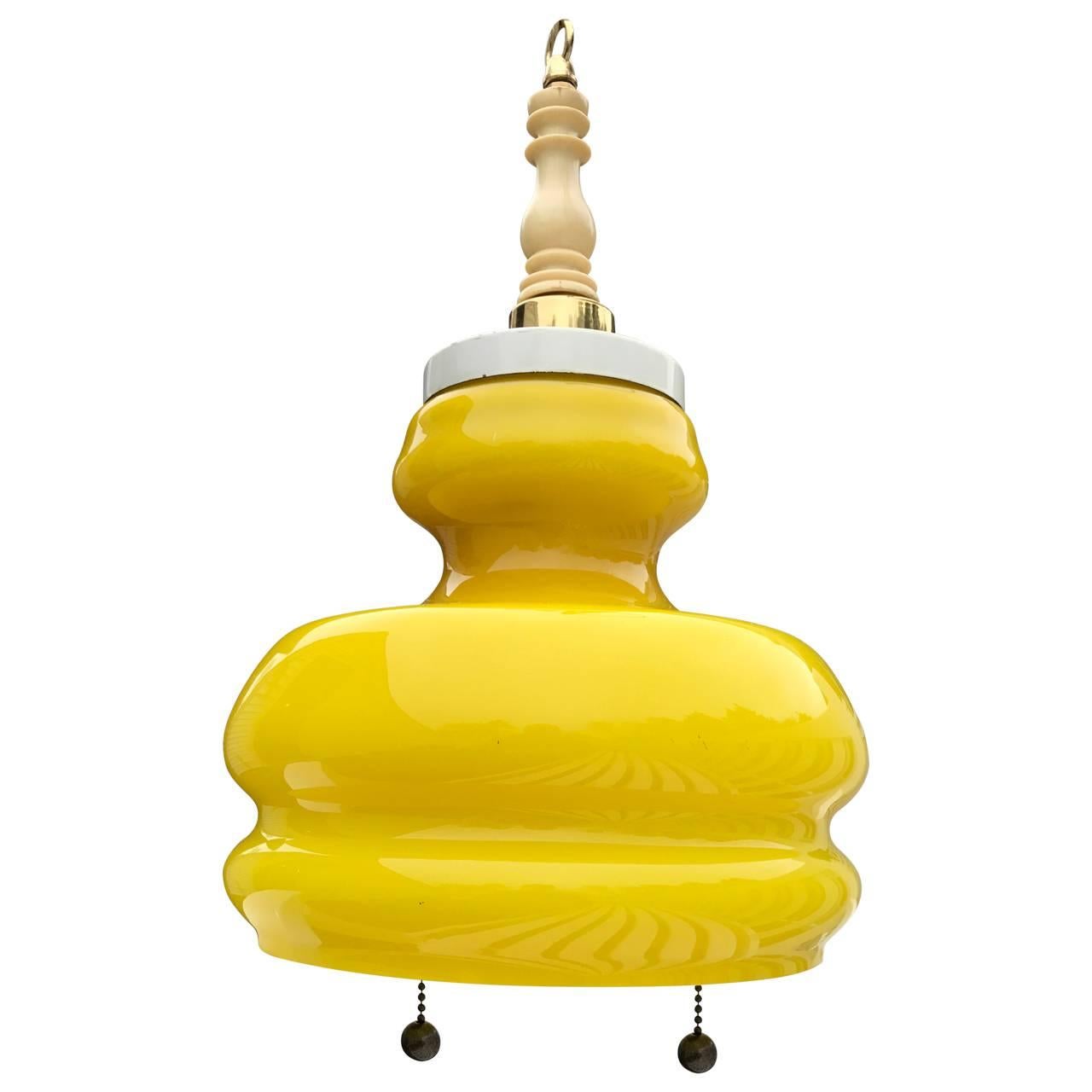 Yellow glass two-light pendant, newly rewired to UL standard.
Pendant comes with a matching brushed gold canopy.


 