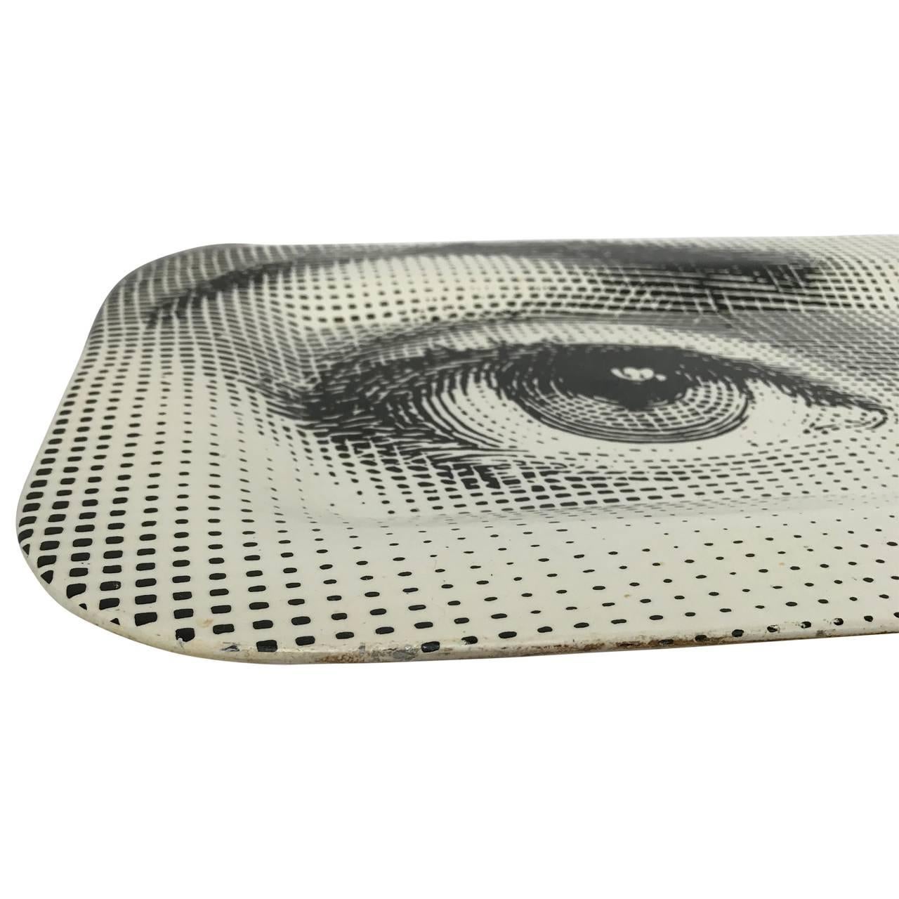 Vintage iconic metal Piero Fornasetti tray, with the original label.
Part of the Tema & Variazioni series, where Fornasetti used the face of the 19th century opera singer Lina Cavaslieri.
This tray and two other of my Fornasetti listings, has