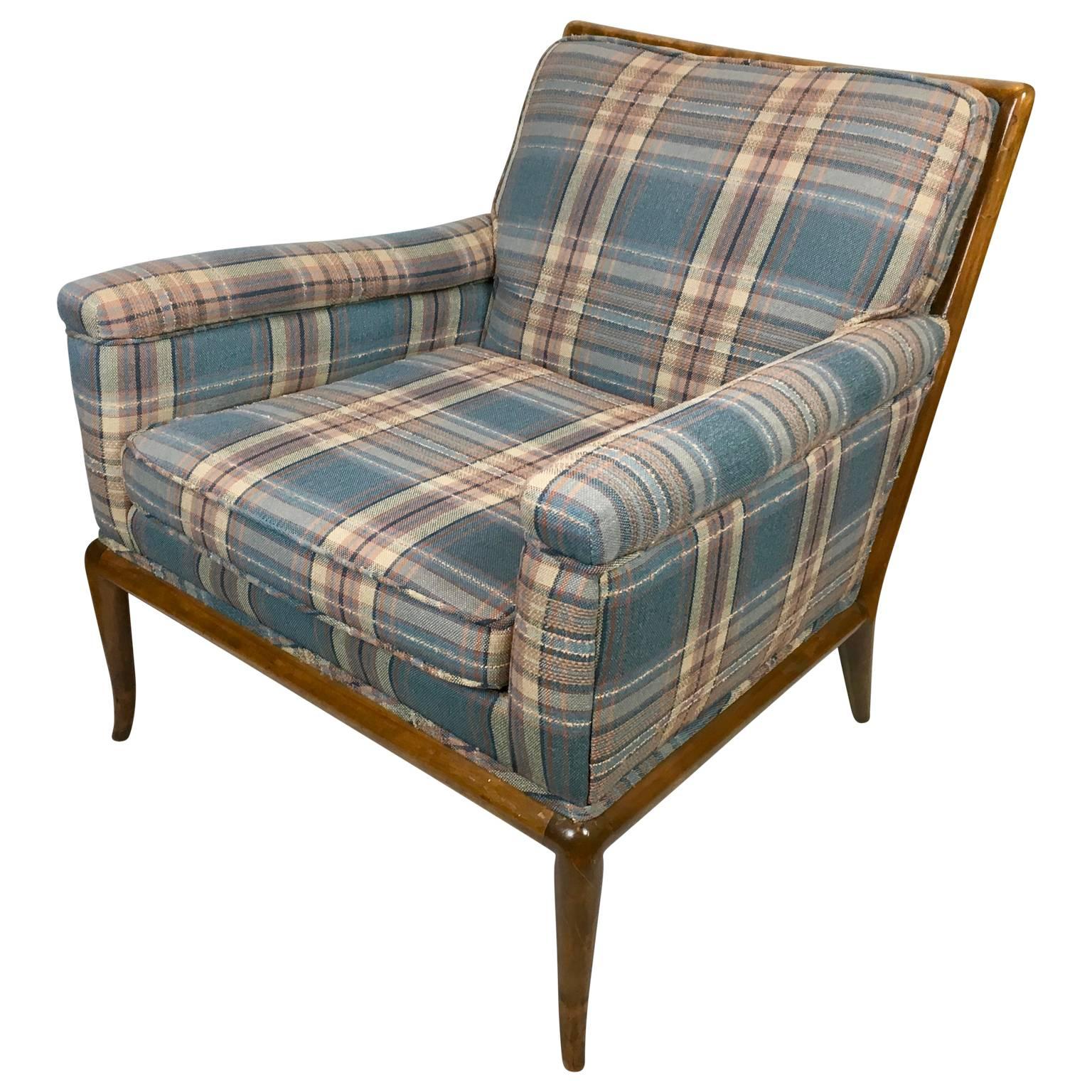 T. H. Robsjohn-Gibbings lounge chair for Widdicomb, circa 1950s. Walnut frame covered in vintage plaid. Frame is in excellent original finish. Fabric is clean, no fading, stains, or wear. Frame has no cracks, gouges or wear.