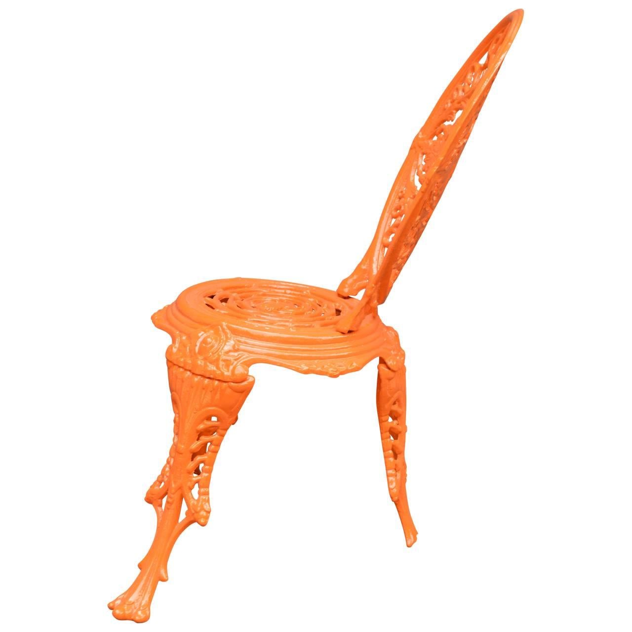 English cast iron chair, in newly powder-coated bright orange.
