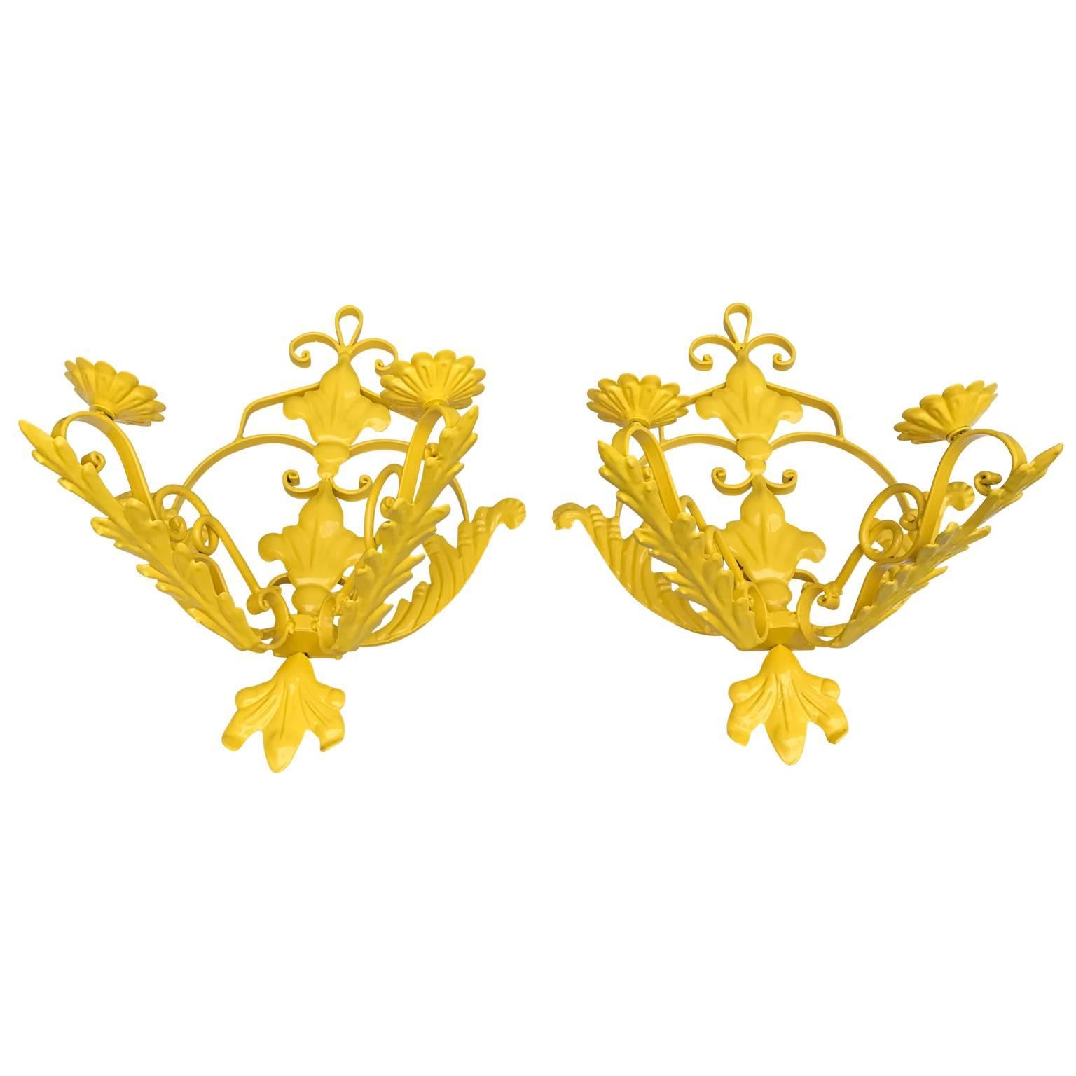 Set of two painted iron wall lights in a bright sunshine yellow powder-coating.
Wall lights can be electrified upon request at an additional cost
