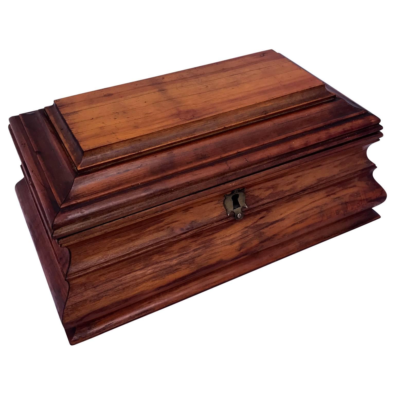 Italian Baroque style jewelry box of fruitwood and original green and white paper on the inside.