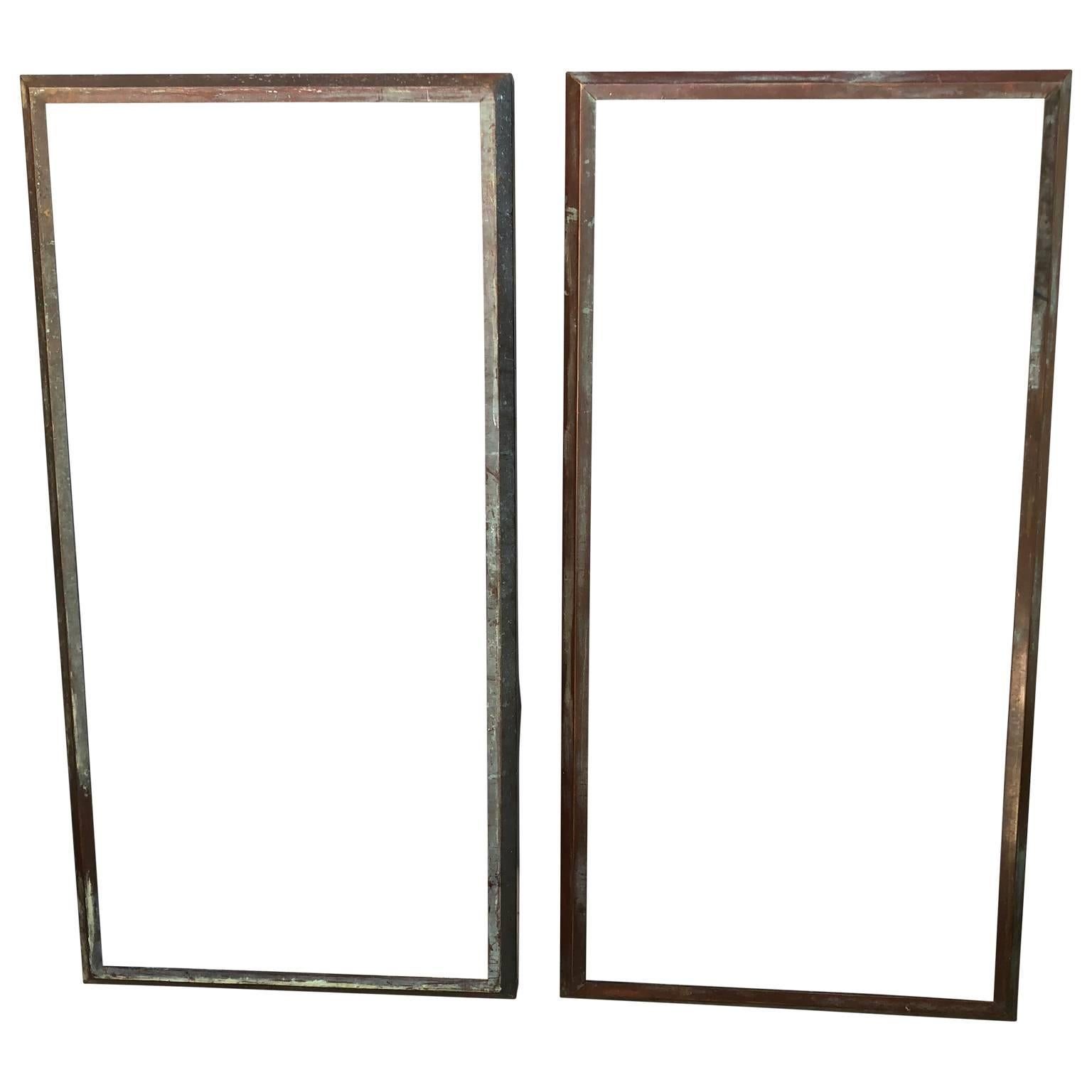 Two large full-length brass-framed mirrors. 

Price includes installation of mirror glass of choice; clear, smoked, antiqued etc.
  