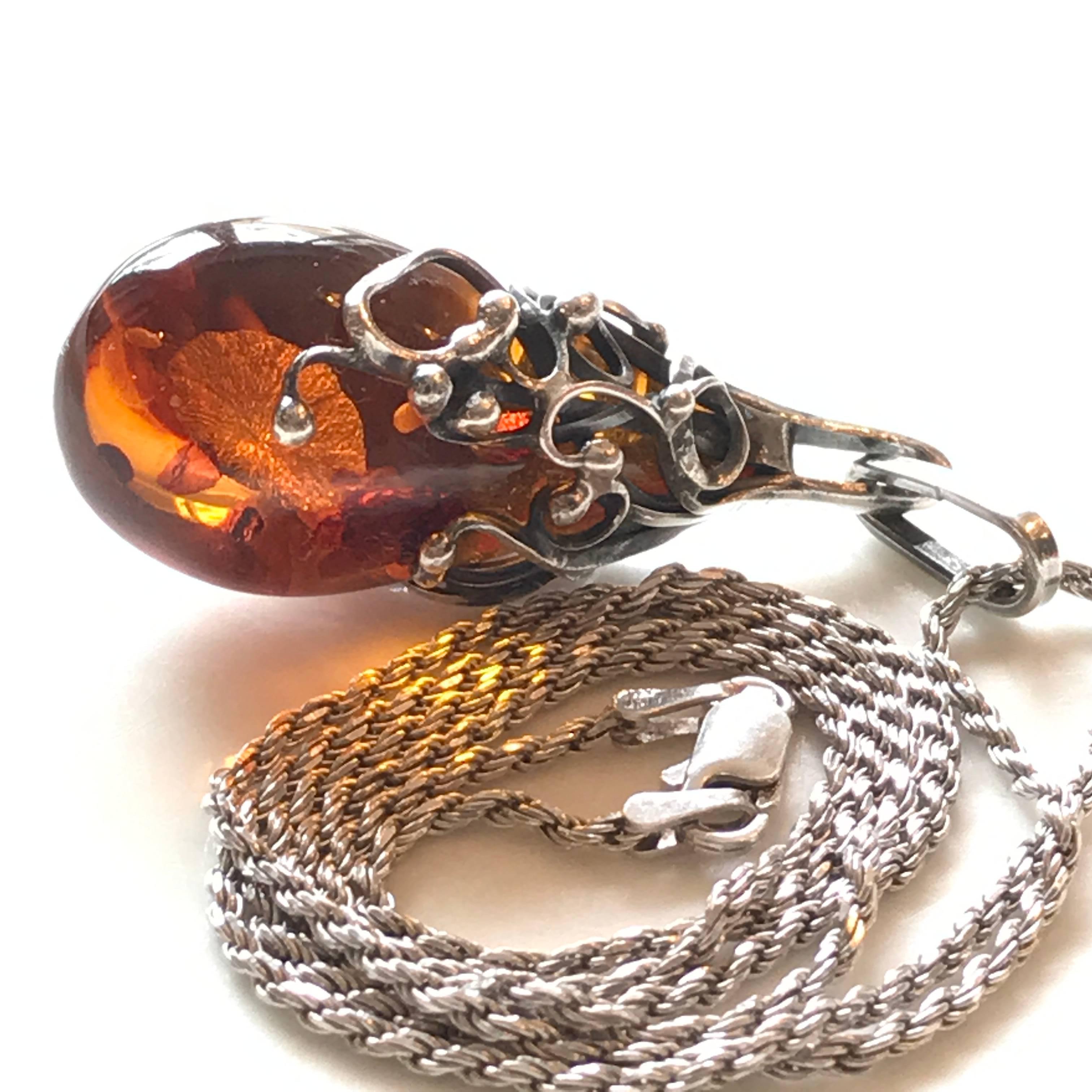 Amber pendant in a sterling silver setting with a Italian 925 silver chain.