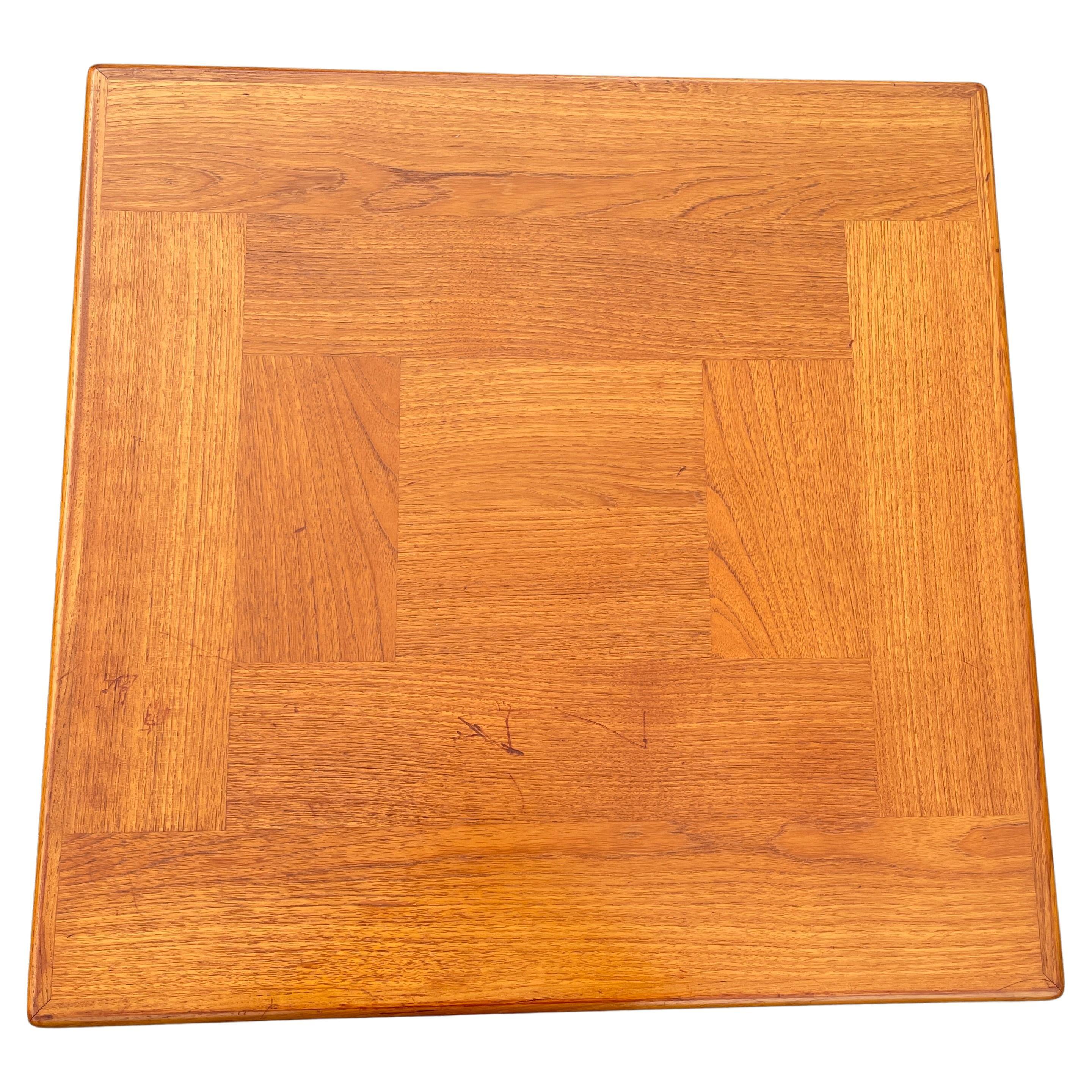 Scandinavian Modern square teak wood coffee table. Manufactured by 
