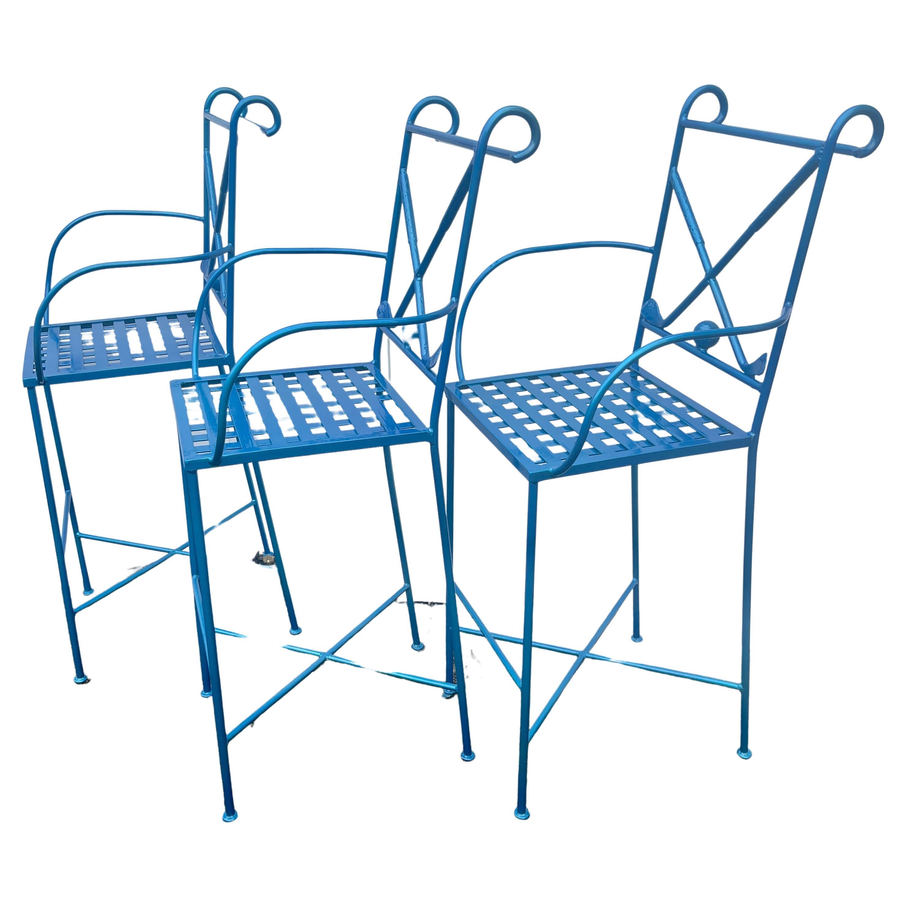 Modern set of metal bar stools, set of three. These exciting barstools with figure of golfer on the back rest has been newly powder coated in Maui Blue (bright metallic blue). The set of barstools are sturdy and exciting in a modern decor. The seat