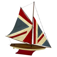 Vintage English Carved Wood Sailboat Model with Parquetry Deck and Union Jack Sailcloth