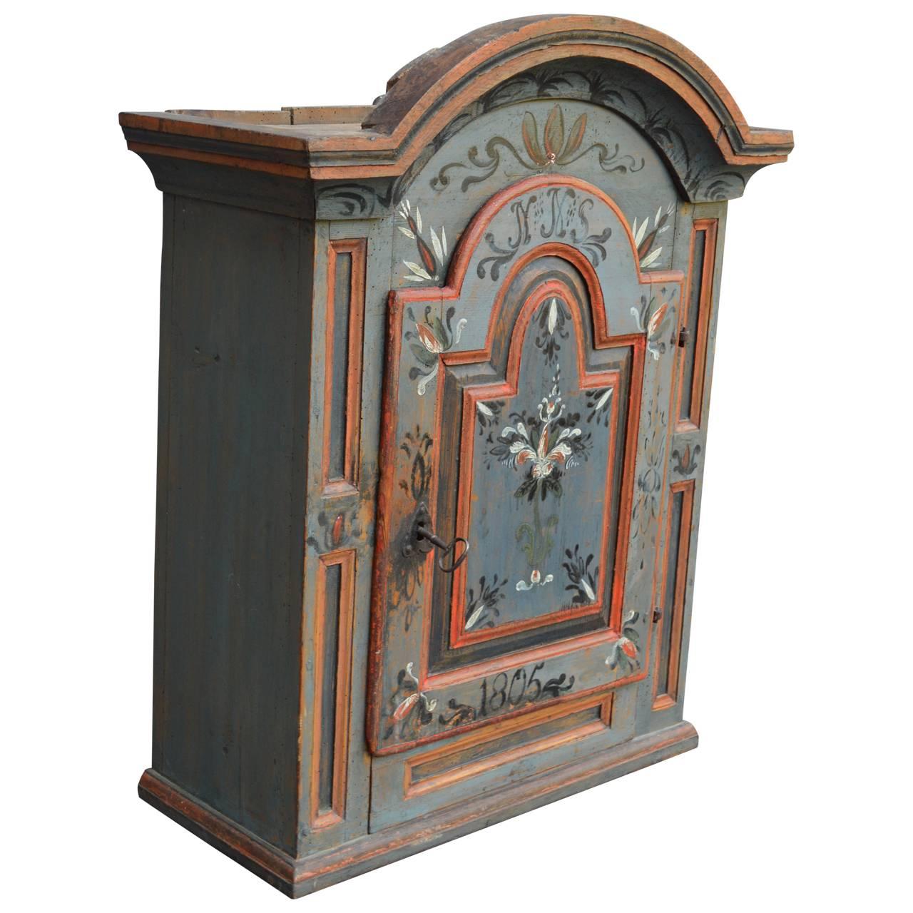 Original painted hanging cabinet, dated 1805.