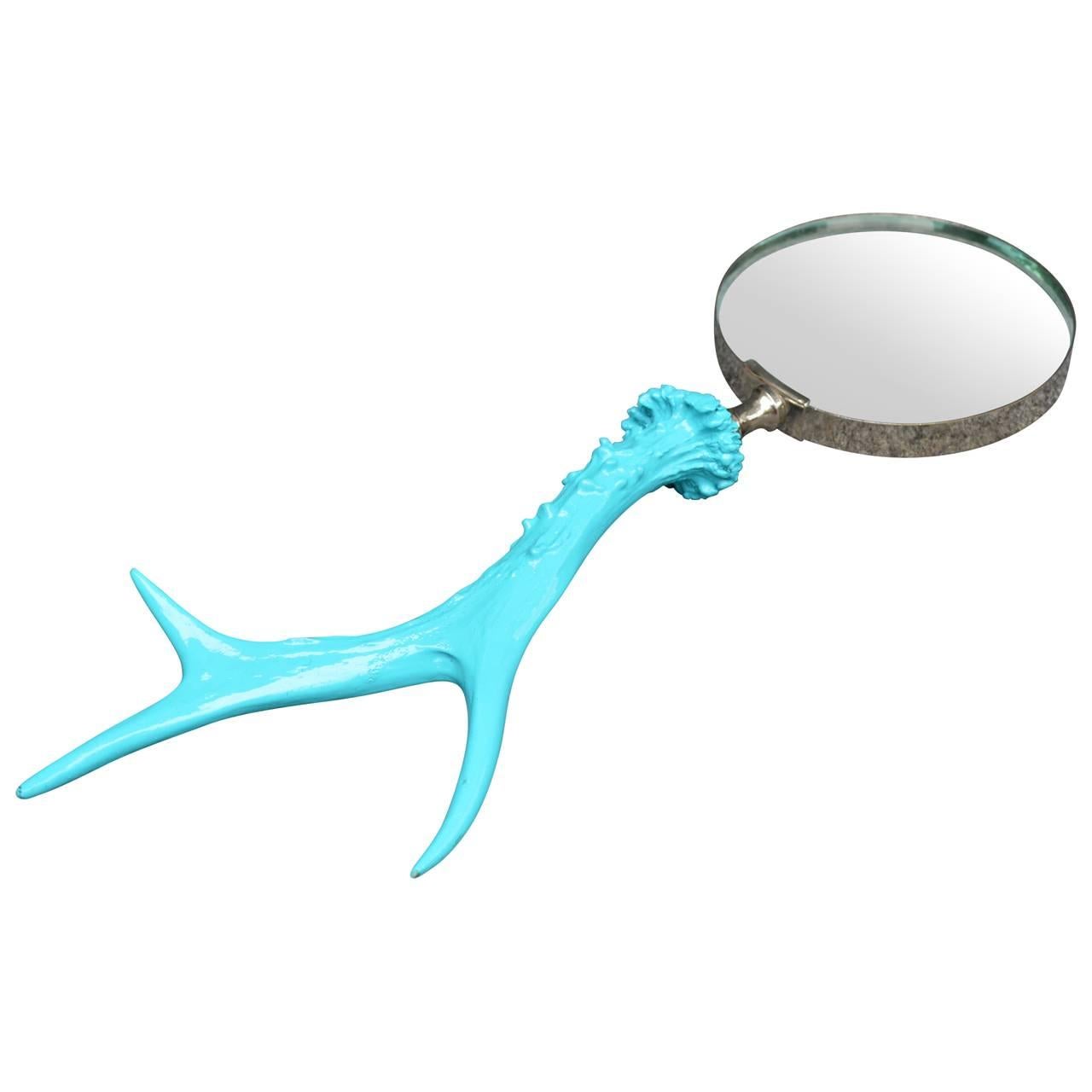 Turquoise antler handle magnifying glass. This vintage magnifying glass has been updated with bright and bold turquoise handle. A fun desk accessory or just a neat addition to an eclectic collection in your home.
 