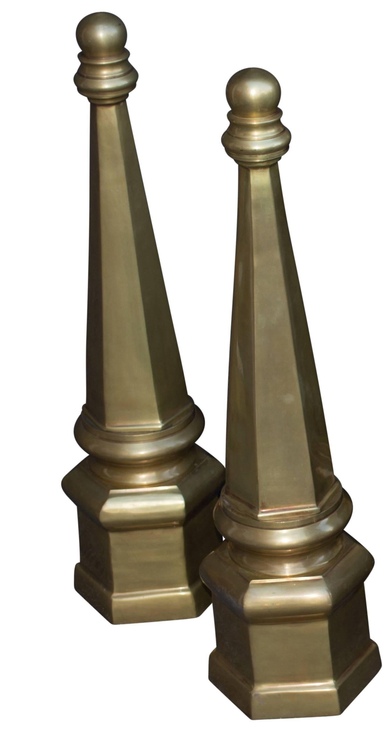 Pair of large brass obelisks.