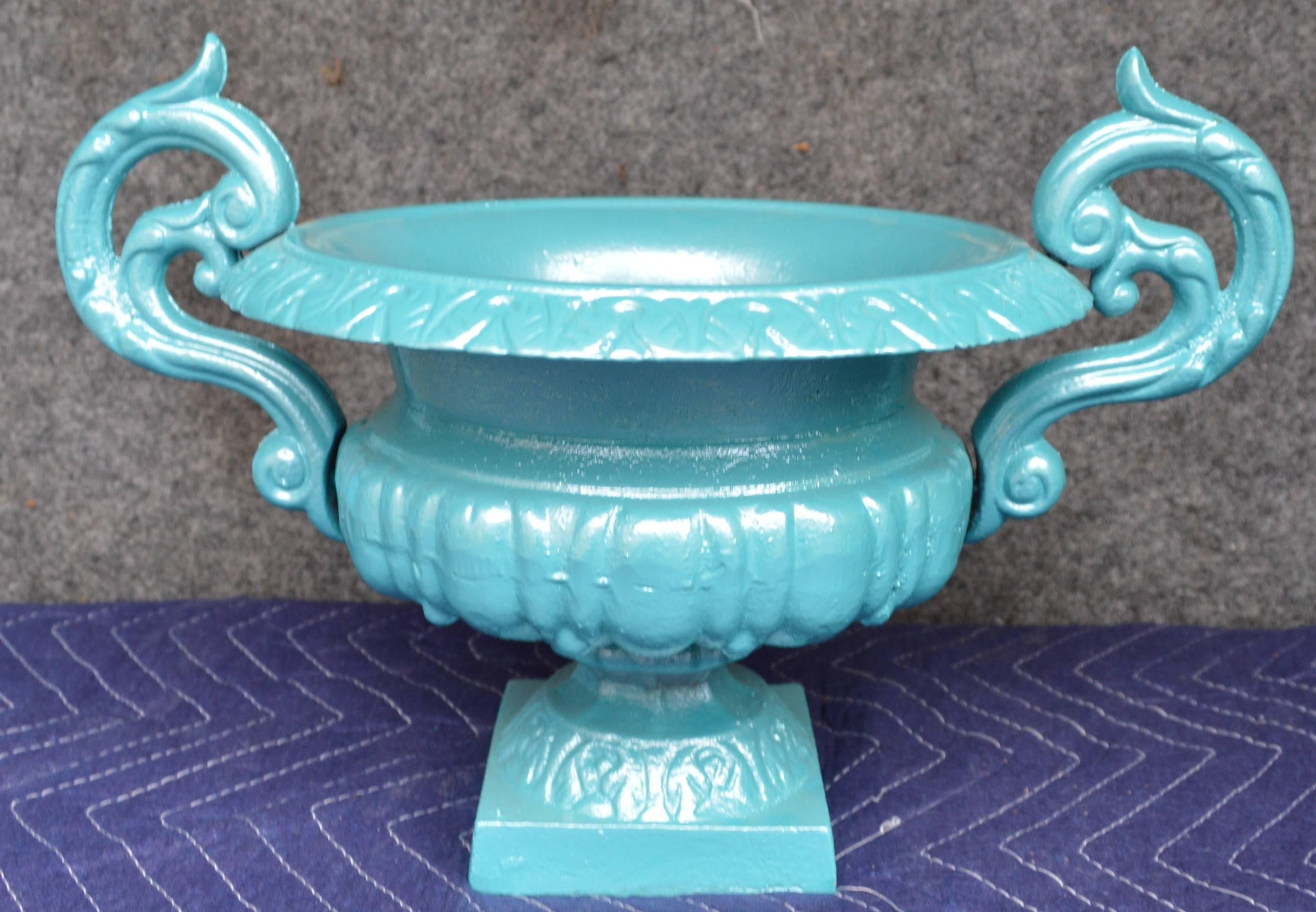 Beautiful turquoise painted wrought iron urn.