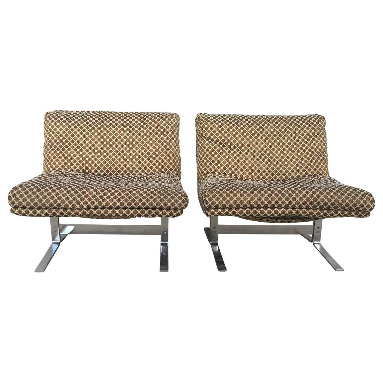 Pair of Midcentury Italian lounge chairs with original fabric and polished steel frame. Super comfortable high quality chairs.