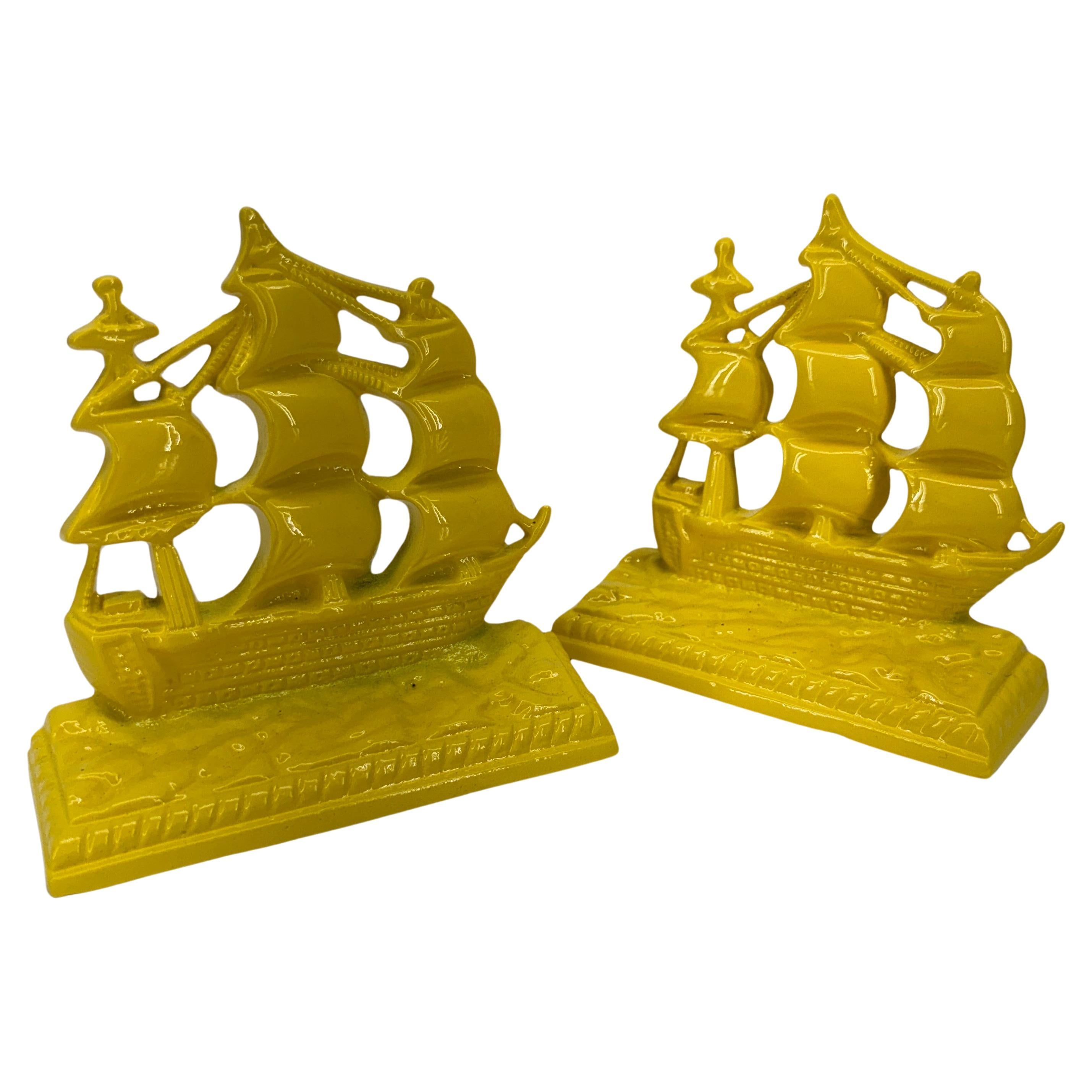 Powder-Coated Sunshine Yellow Set of Mid-Century Sailboat Bookends 

These solid vintage newly powder-coated boats are both form and function. Fabulous pair displayed on a bookshelf or desk or standing alone as sculptures on a table as a statement