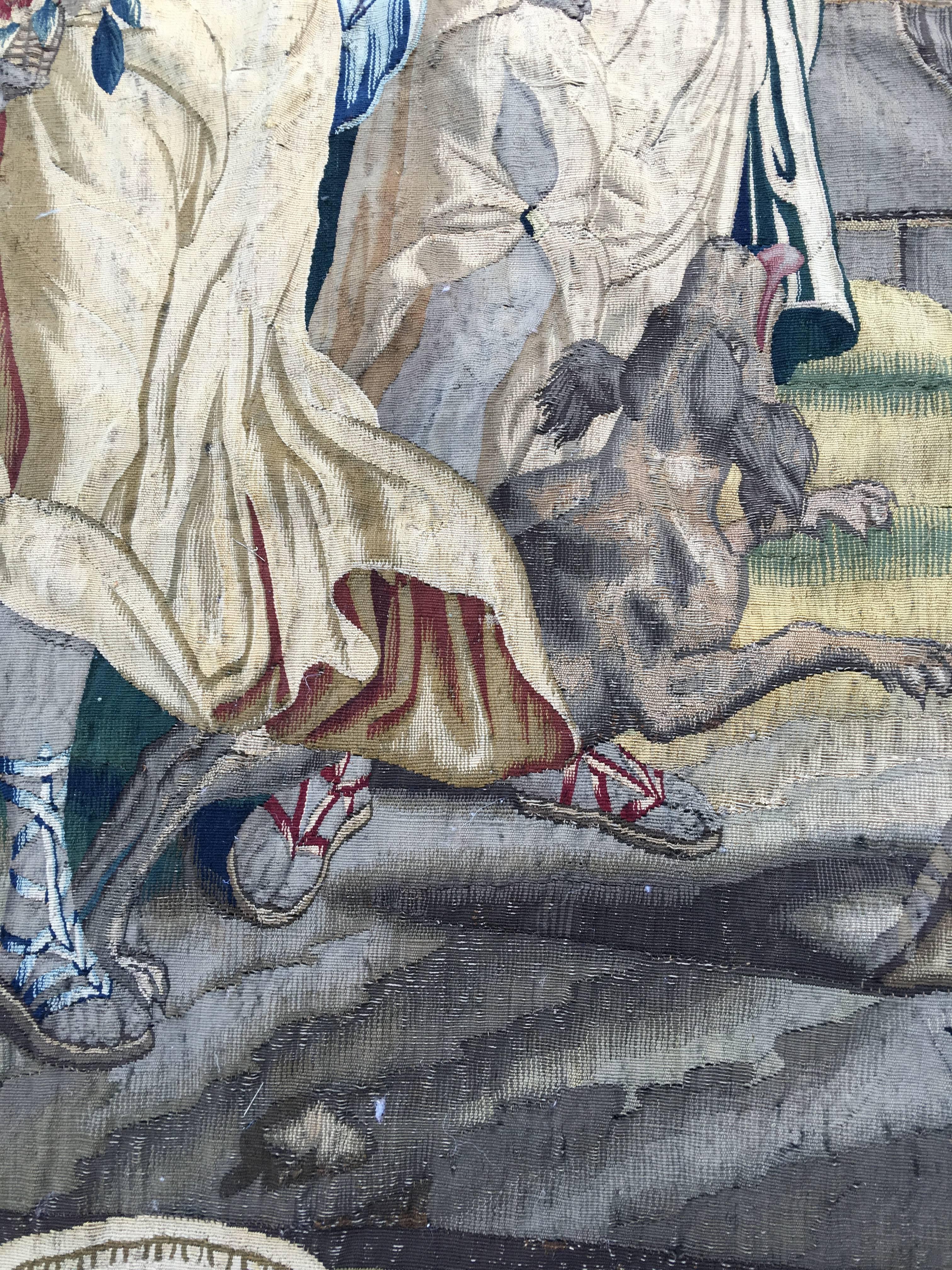 Large early Aubusson tapestry with multiple figures and a dog.