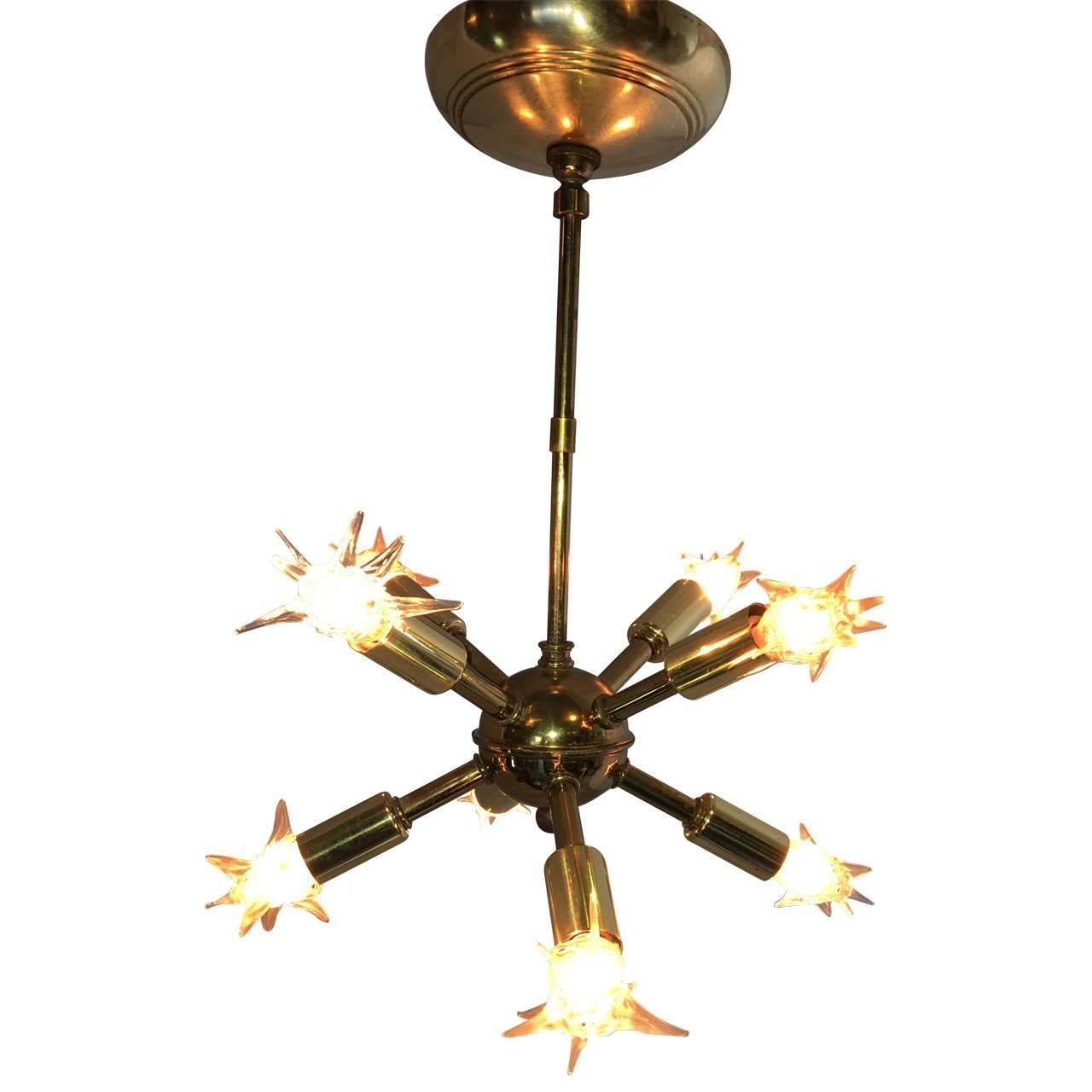 Original brass Sputnik chandelier with authentic 60's light bulbs. 
8 arms.
