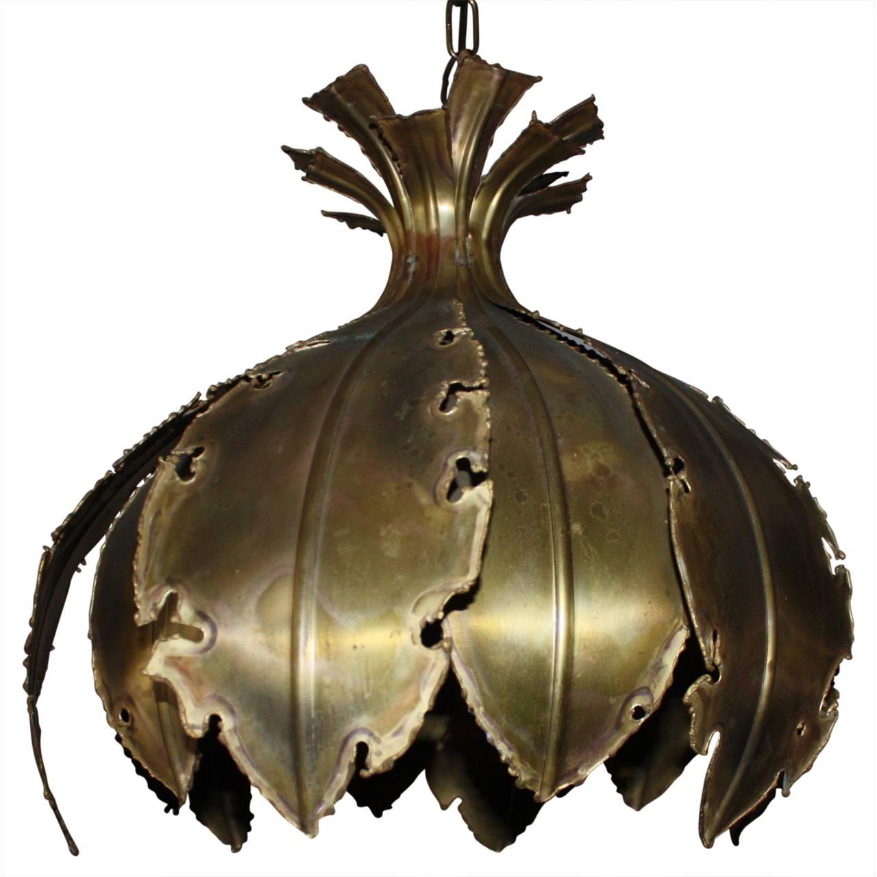 Incredible Svend Aage Holm Sorensen brass tulip lamp. The pendant lamp is made of torch cut brass. Comes with the original brass fixture, canopy and chain.