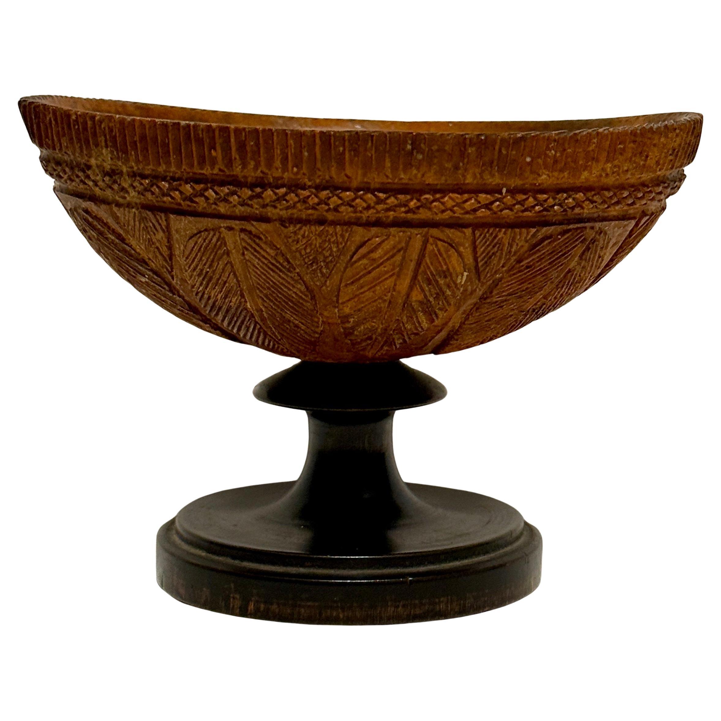 A charming small antique hand craved coconut bowl, England Circa 1820’s. Displays beautifully on a coffee table or side table standing alone or as part of a collection.