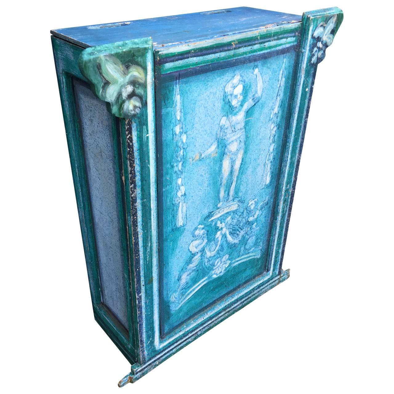 Foldable wooden radiator screen with blue, painted centerpiece with standing putti.