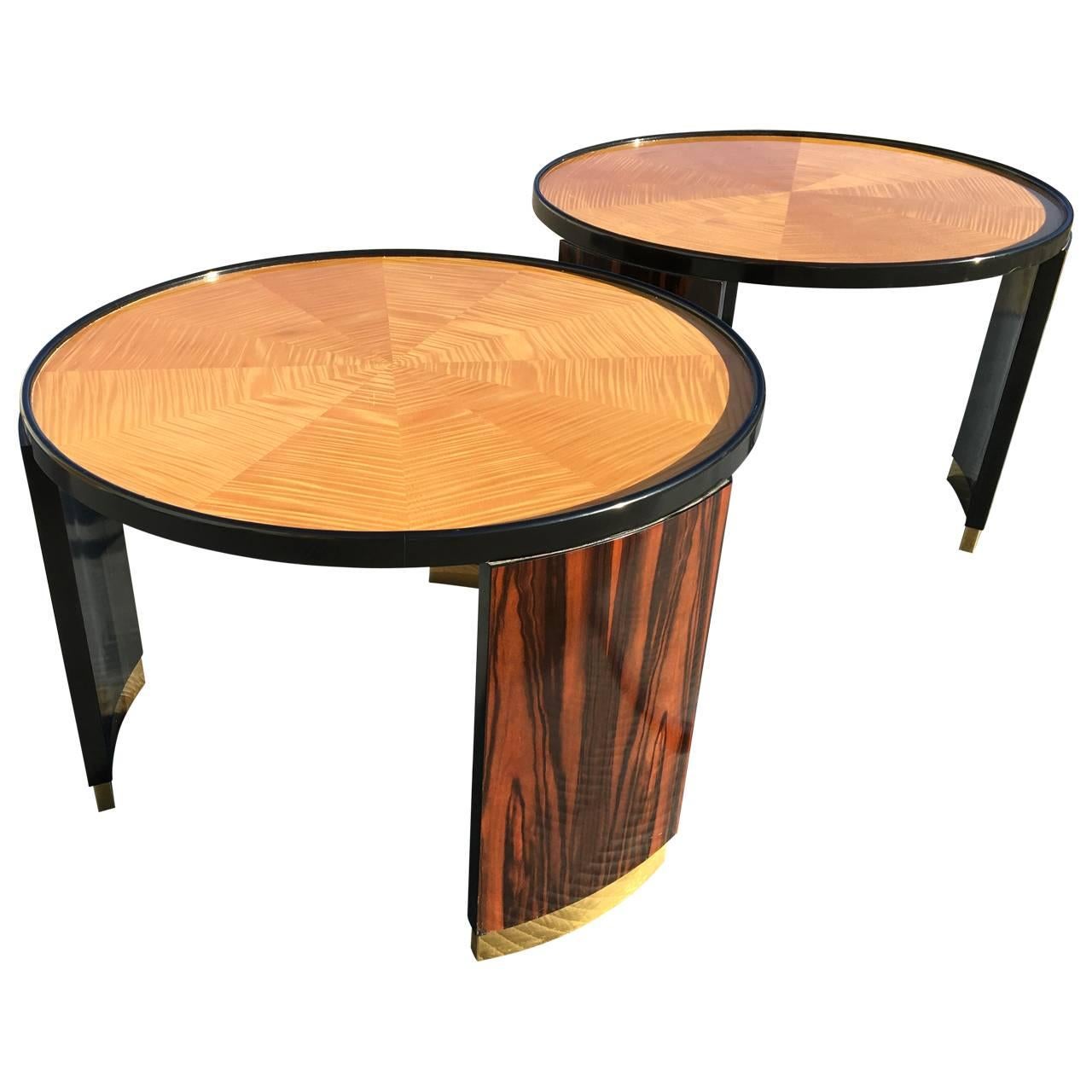 A stunning pair of side tables designed by Bernard Rohde are in super condition. The tops are in sunburst design, made of tiger maple and with black lacquered edge. The sides or legs are made of exotic Madagascar ebony with brass caps at the base.